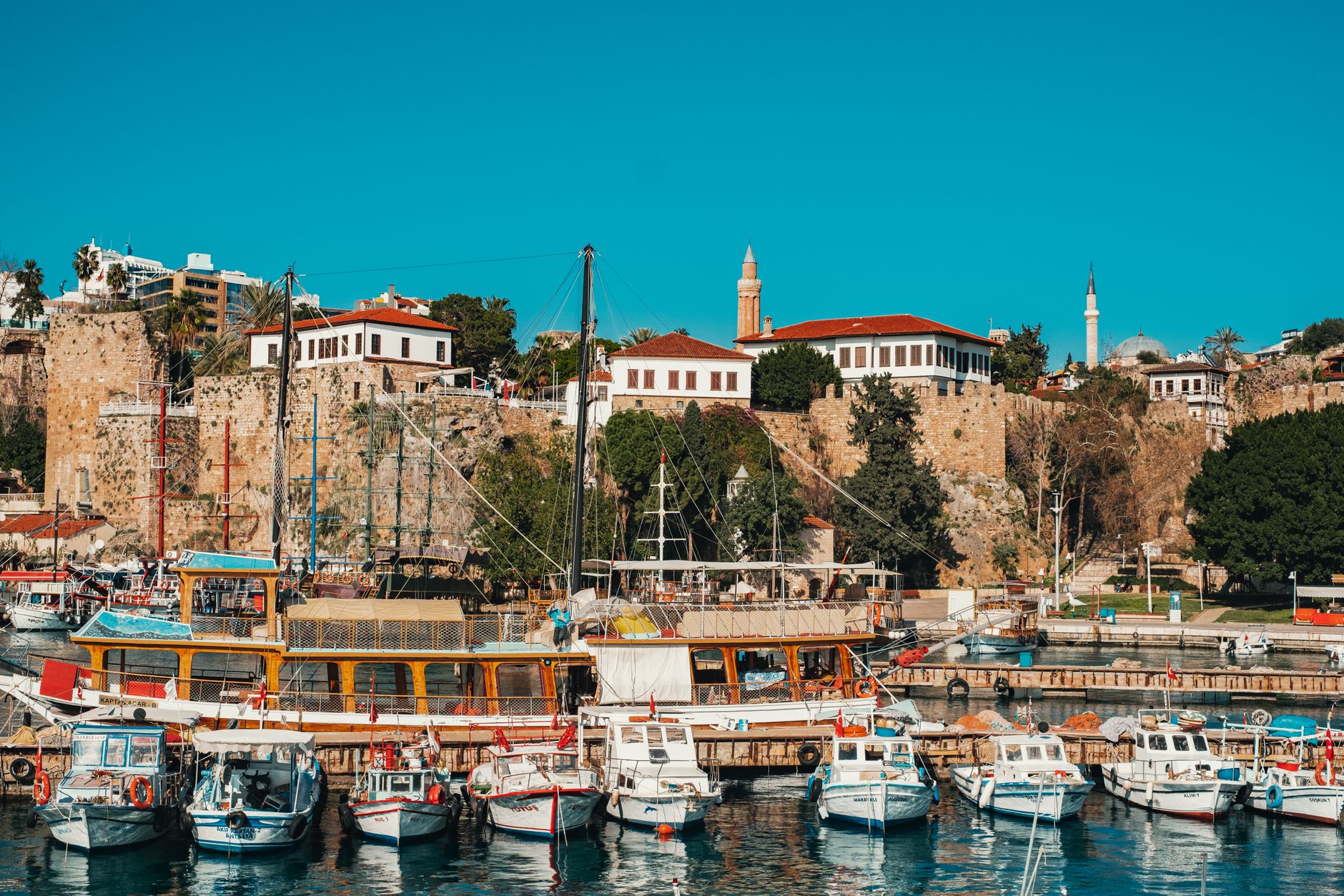 Scenic view of Kaleiçi in Antalya, featuring historic buildings and moored boats.