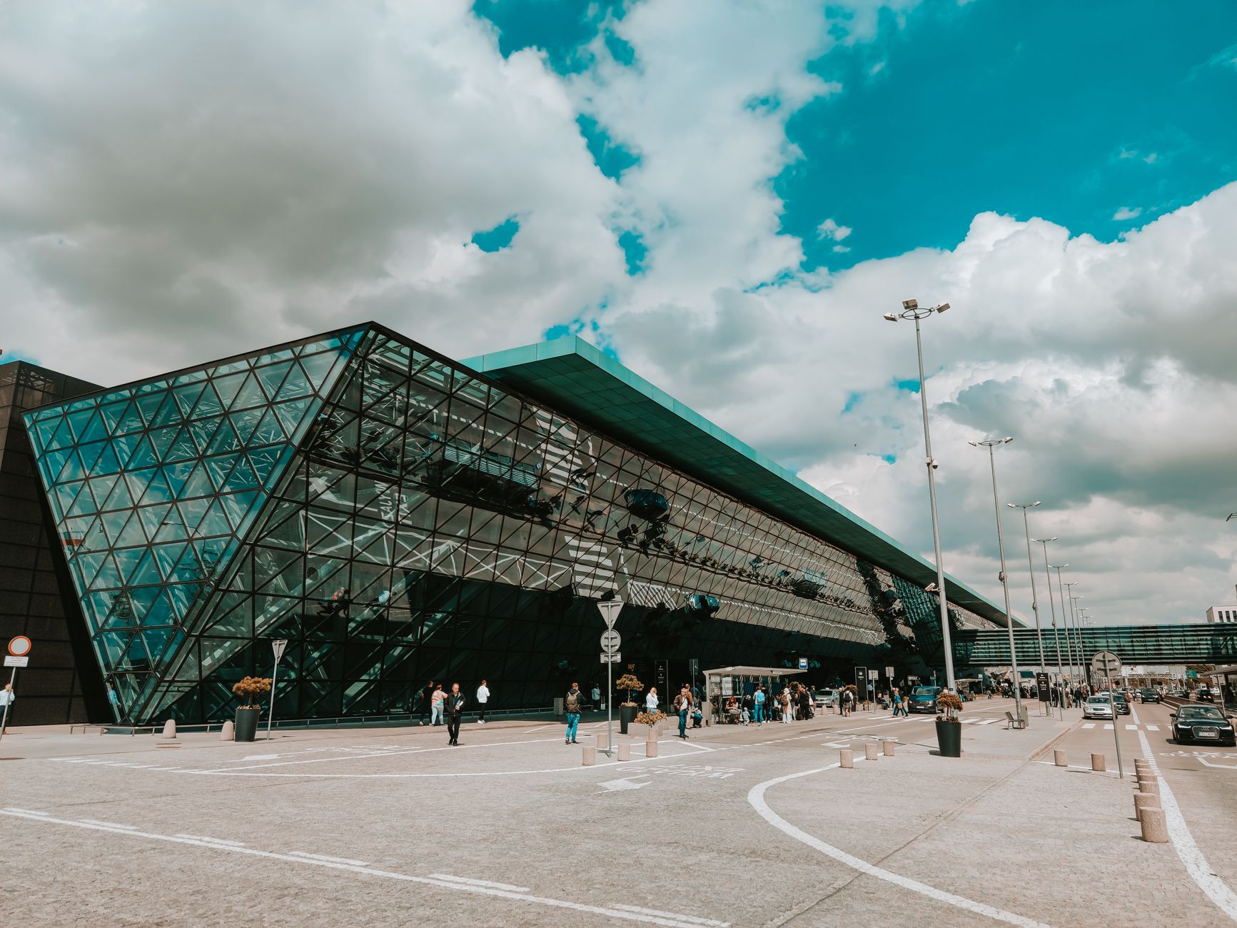 Busy airport terminal showcasing passengers arriving and departing, reflecting global connectivity.
