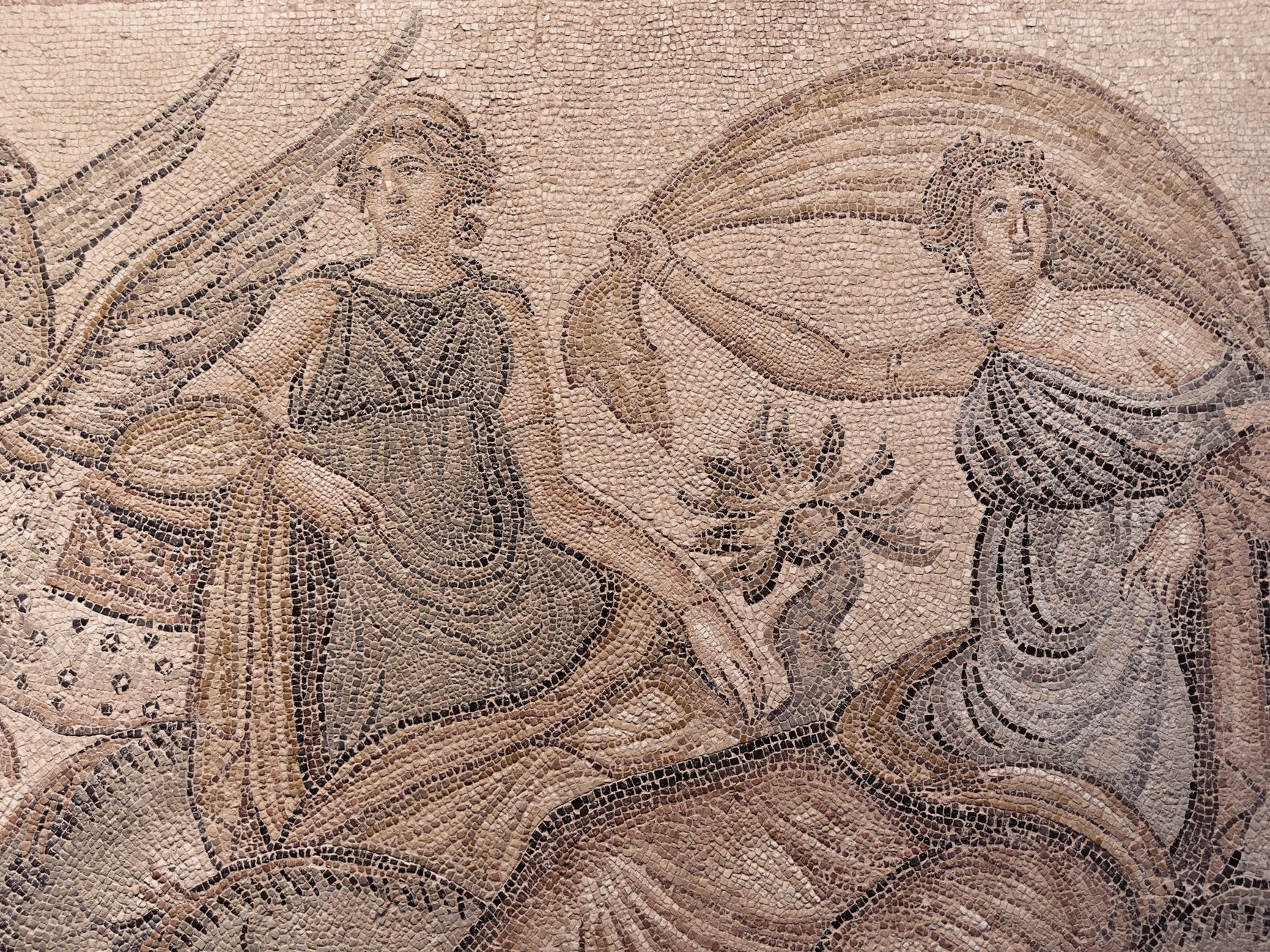 Detail of the Gypsy Girl mosaic showcasing intricate figures and patterns.