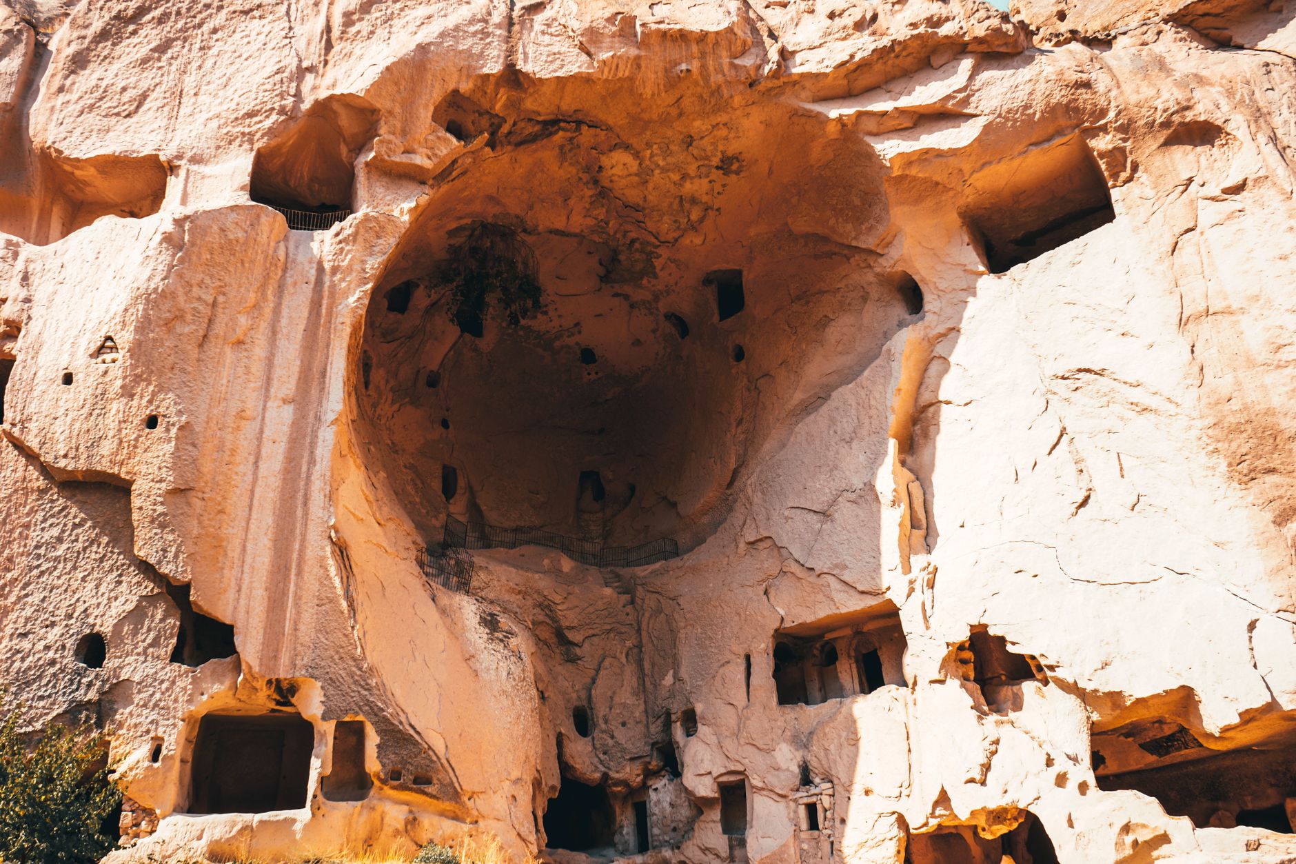 Exterior view of Selime Monastery, carved into a rock face in Cappadocia.