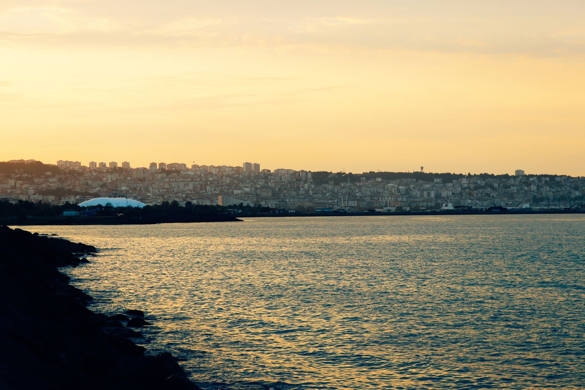 Serene view of Samsun's coastline at sunset, highlighting parks and urban development.