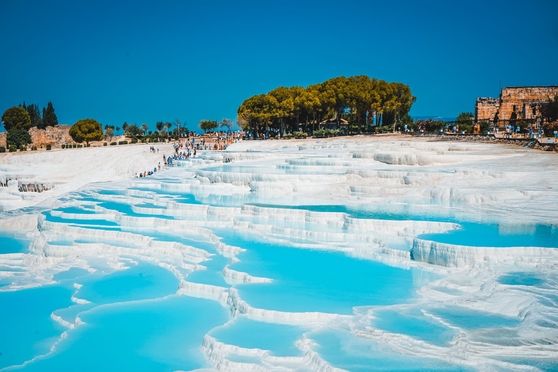 Stunning Pamukkale thermal pools with turquoise water and terraces.
