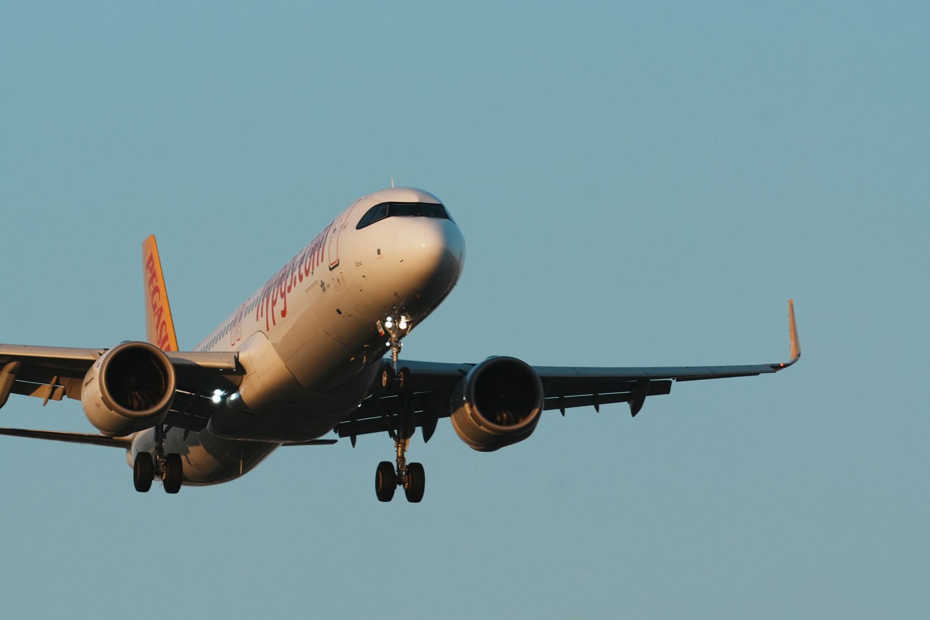 An airplane approaching Istanbul Sabiha Gökçen Airport, highlighting travel access.