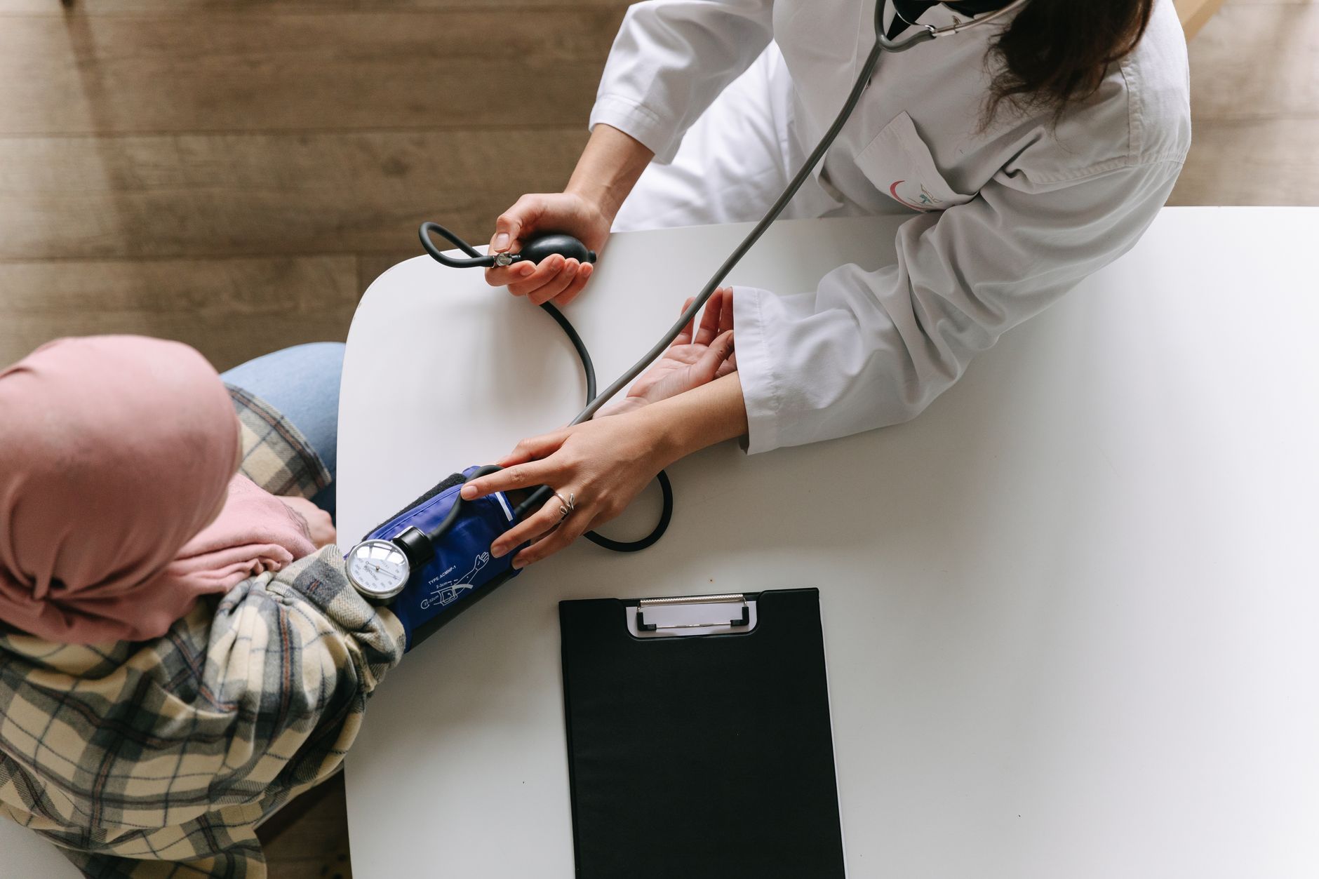 Medical staff measuring blood pressure of a patient in a Turkish hospital.