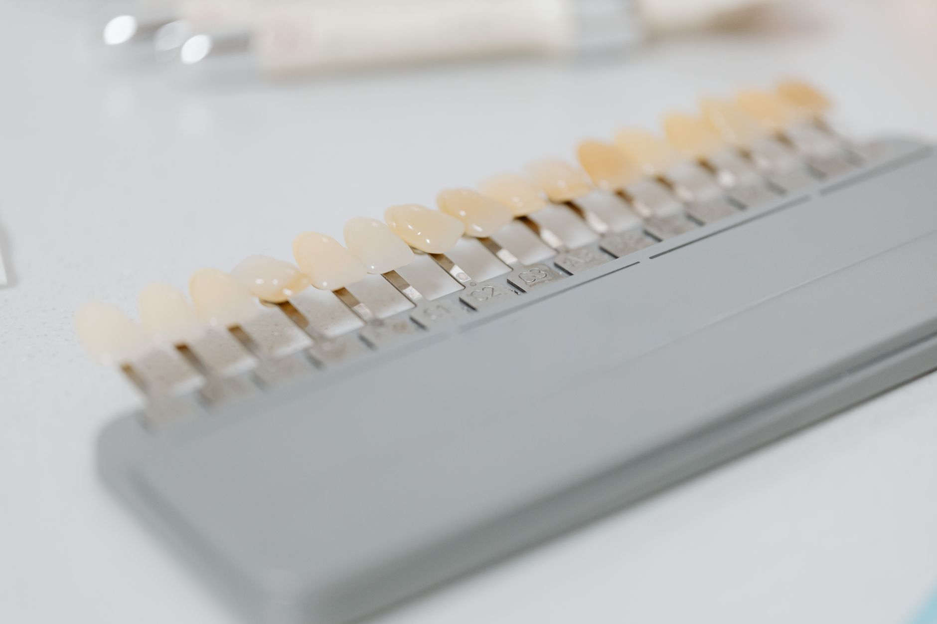 Porcelain veneer color samples arranged in a dental lab for custom design.