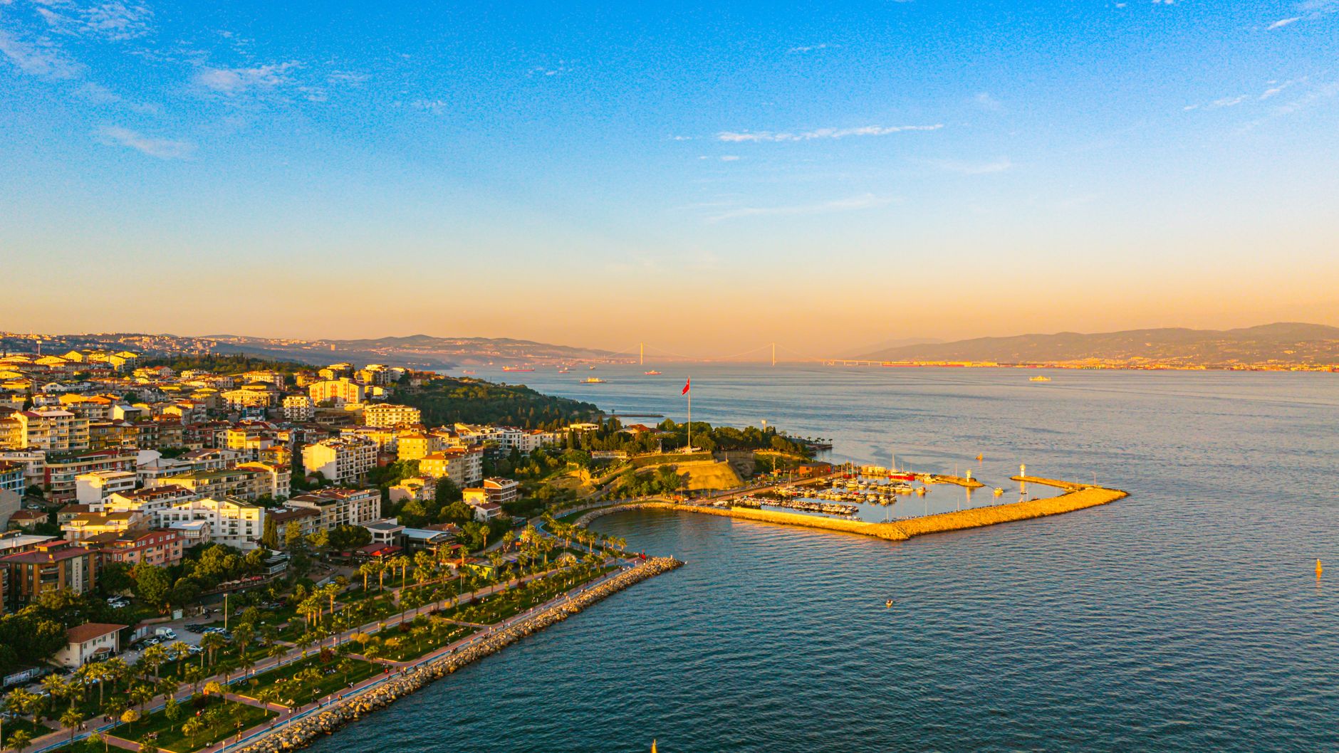 Aerial view of Kocaeli coastline with the Marmara Sea, palm trees, and relaxed waterfront ambiance.