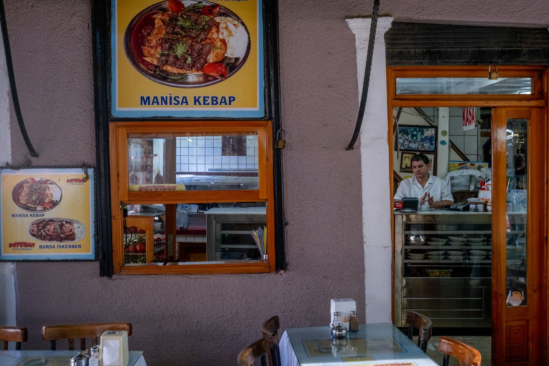 Inside a Manisa Kebap restaurant showcasing warm Turkish hospitality and delicious kebab dishes.