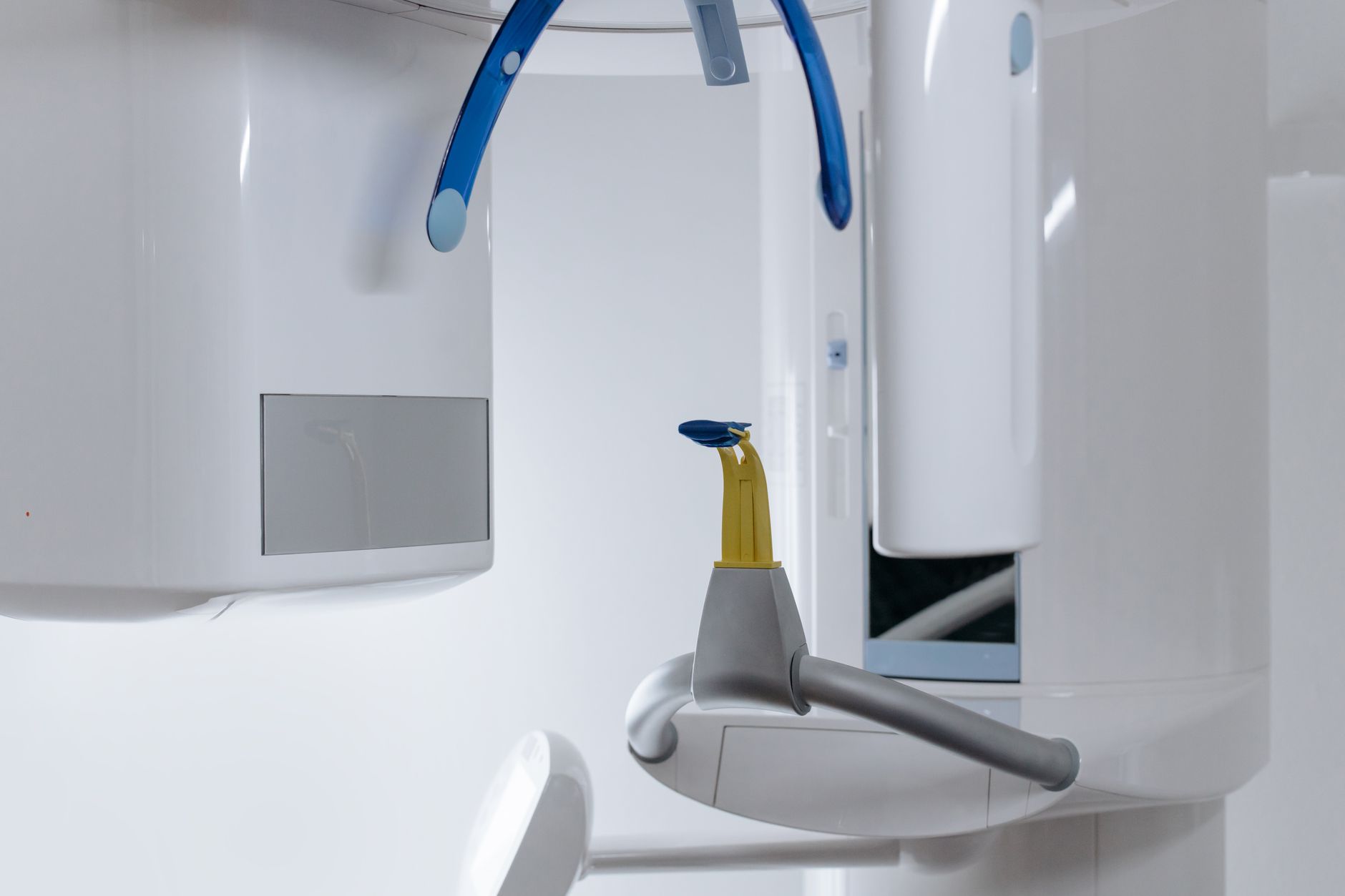 Close-up of a CAD/CAM machine used by a dental technician in a modern clinic.