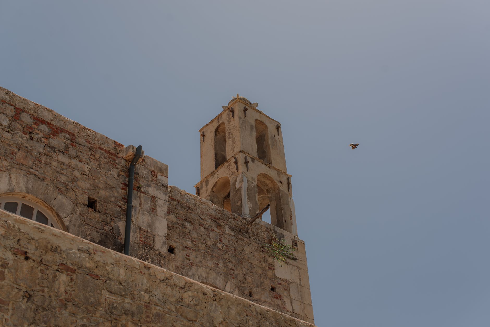 View of the stone walls and bell tower of the historic Church of St. Nicholas in Demre.
