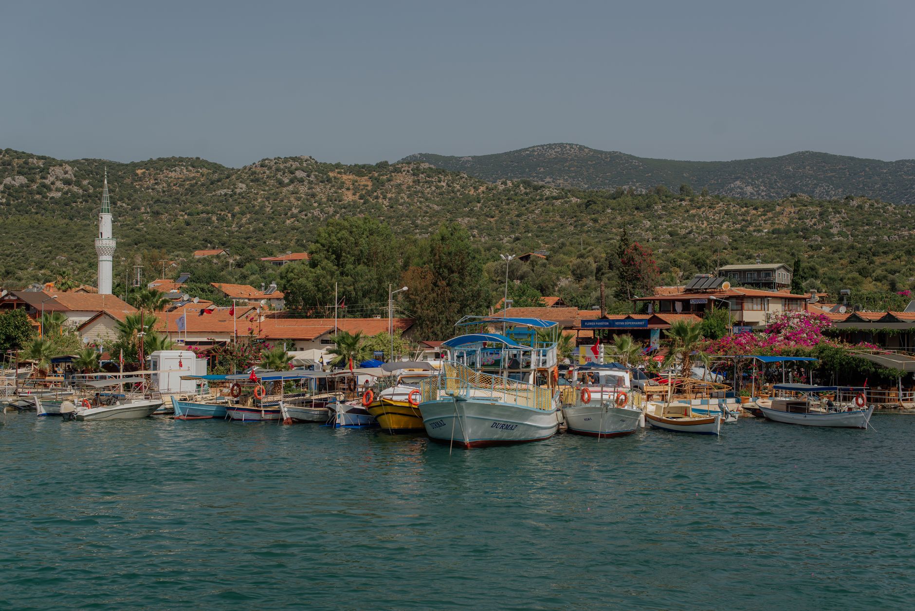 Demre harbor featuring various boats and warm winter sunlight along the beautiful Turquoise Coast.