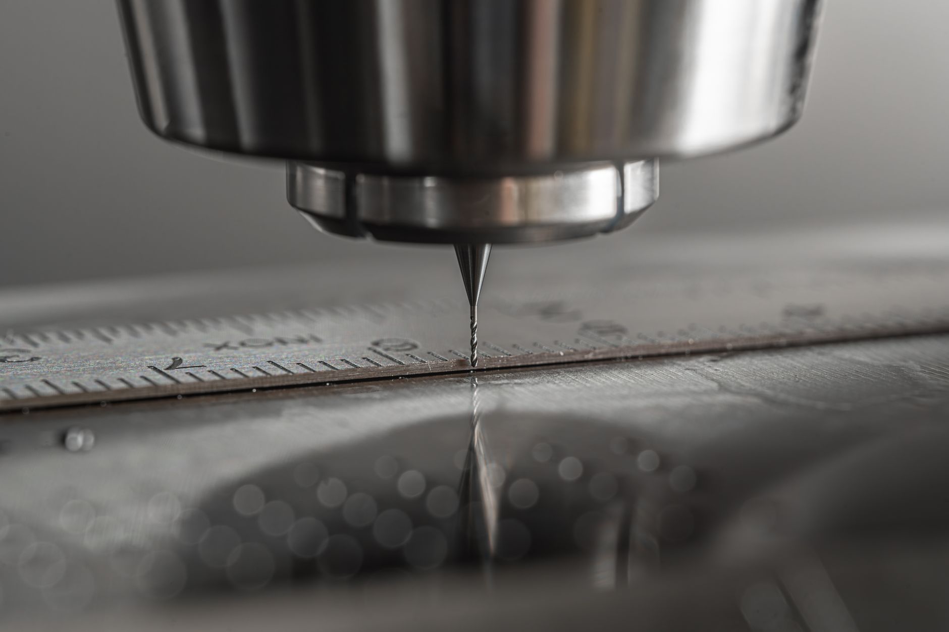Close-up of a CAD/CAM milling machine milling zirconia in a dental lab.