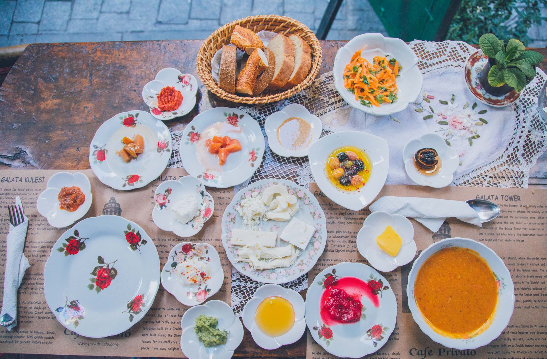 A beautiful Turkish breakfast spread featuring cheeses, olives, jams, and bread at Cafe Privato, Galata.