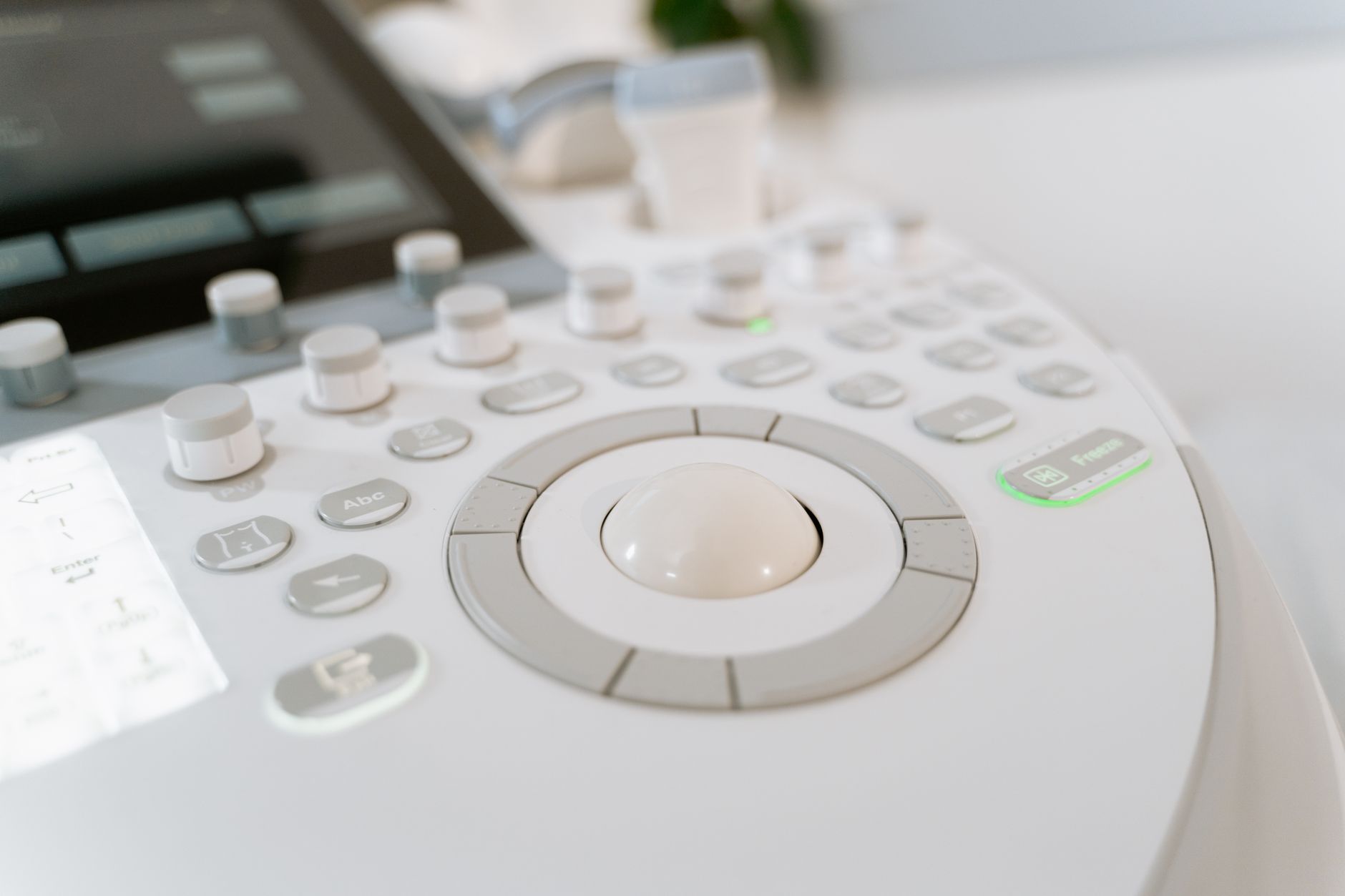 Close-up of diagnostic imaging device controls for retina and glaucoma assessment.