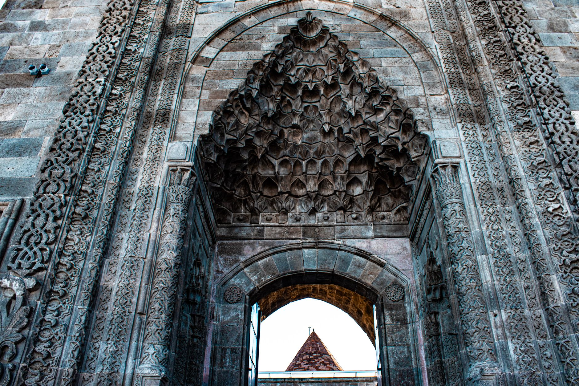 Intricate stone carvings and archway design at Hunat Hatun Complex in Kayseri, showcasing Seljuk architecture.