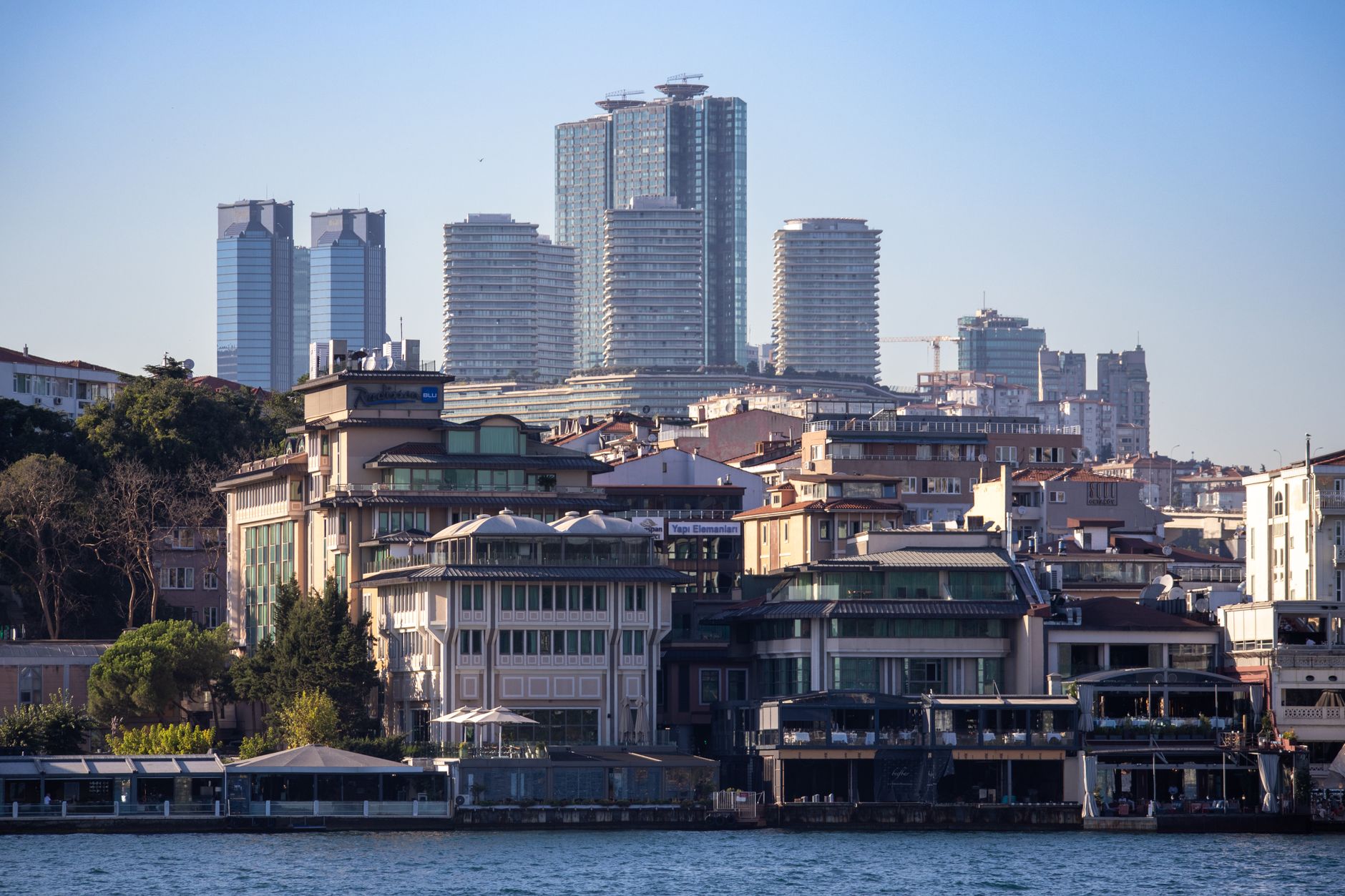 A panoramic view of Istanbul's skyline featuring modern buildings and waterfront, ideal for medical tourism.