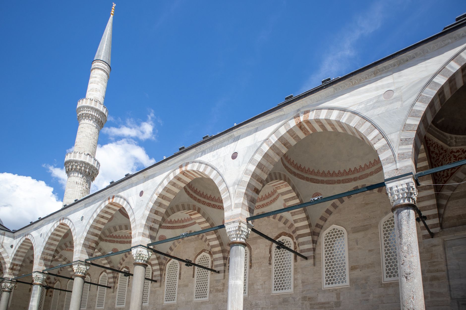 The towering minaret and arched colonnades of Fatih Mosque, Istanbul.