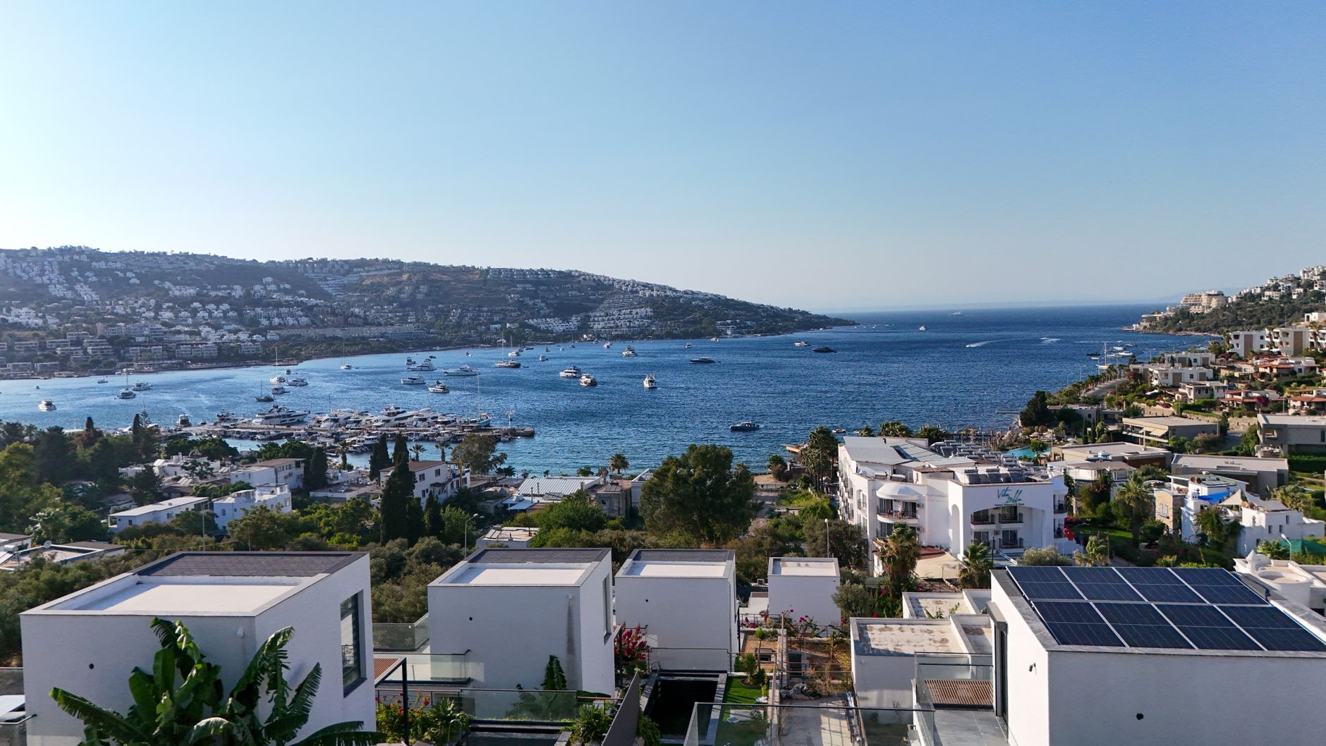 Panoramic view of Bodrum's coast featuring yachts and serene waters, perfect for relaxation and recovery.