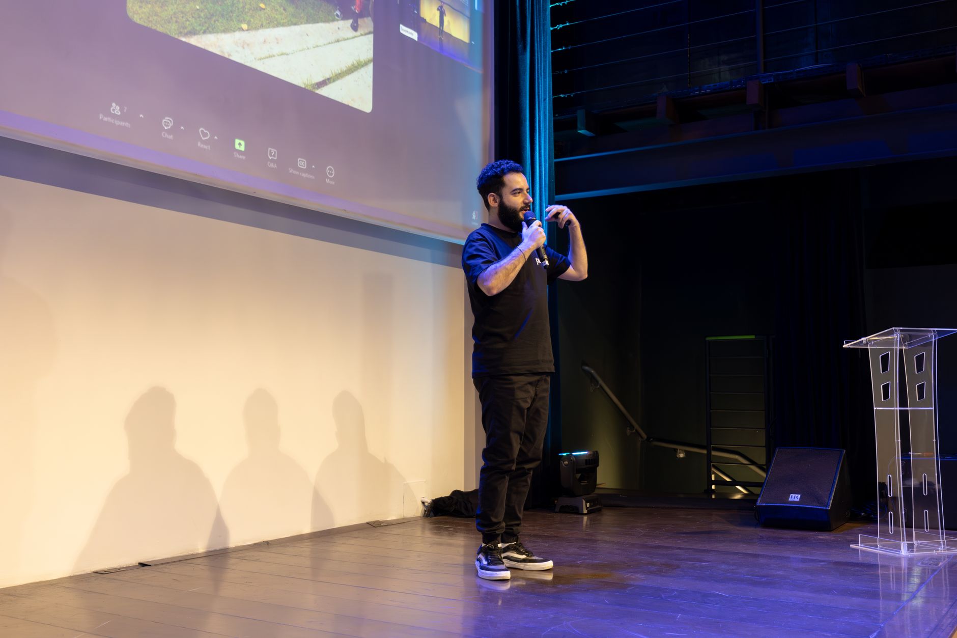 Aesthetic surgeon speaking at an international congress event on stage.
