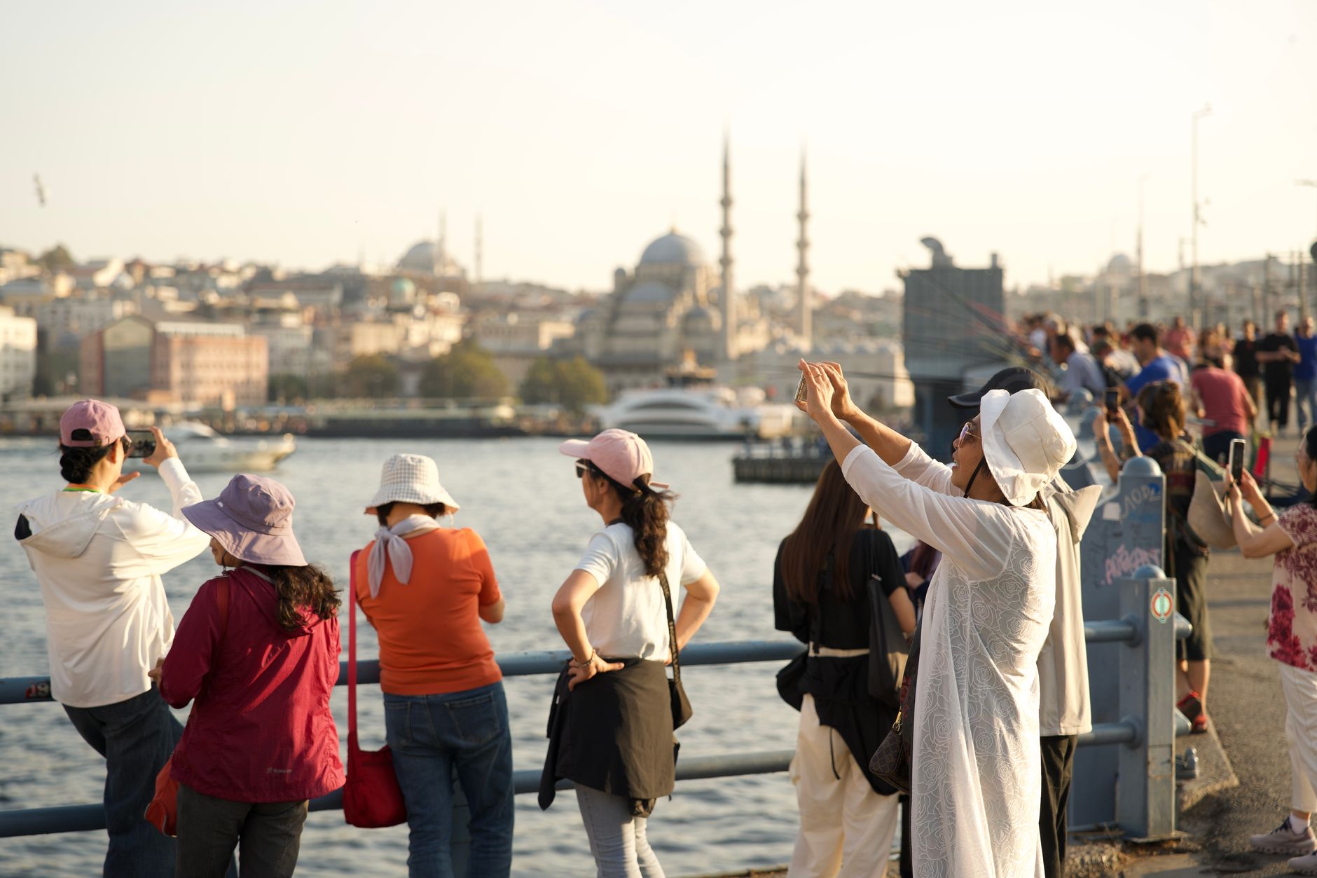 Gulf patients capturing memories at Istanbul's waterfront, with stunning cityscape in the background.