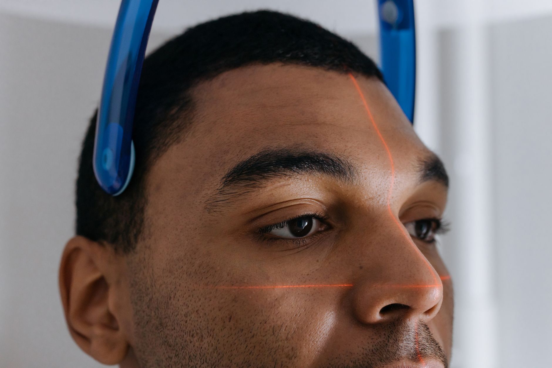 Close-up of a patient undergoing retina imaging with laser guides in Istanbul.