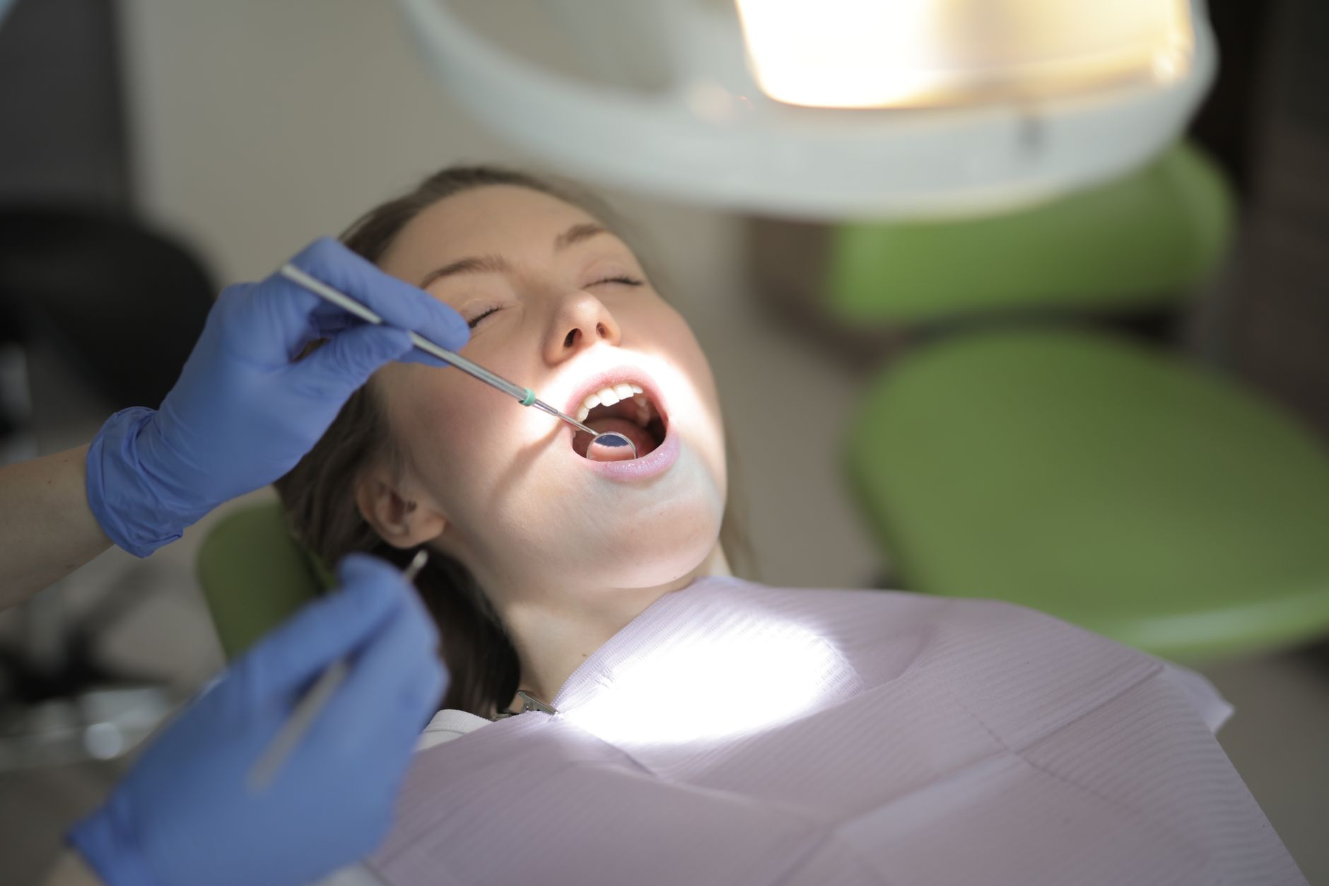 Patient receiving dental care in a modern Turkish clinic with high-tech equipment.