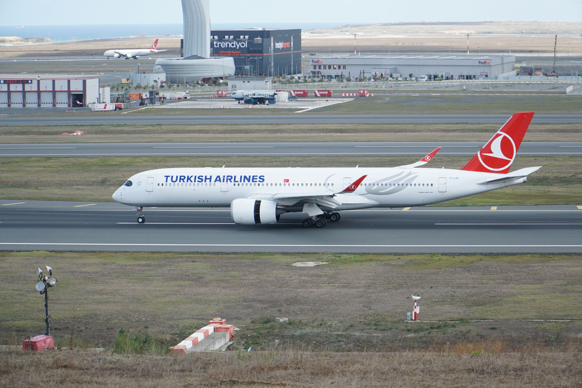 A Turkish Airlines aircraft taxiing on the runway at Istanbul Airport.