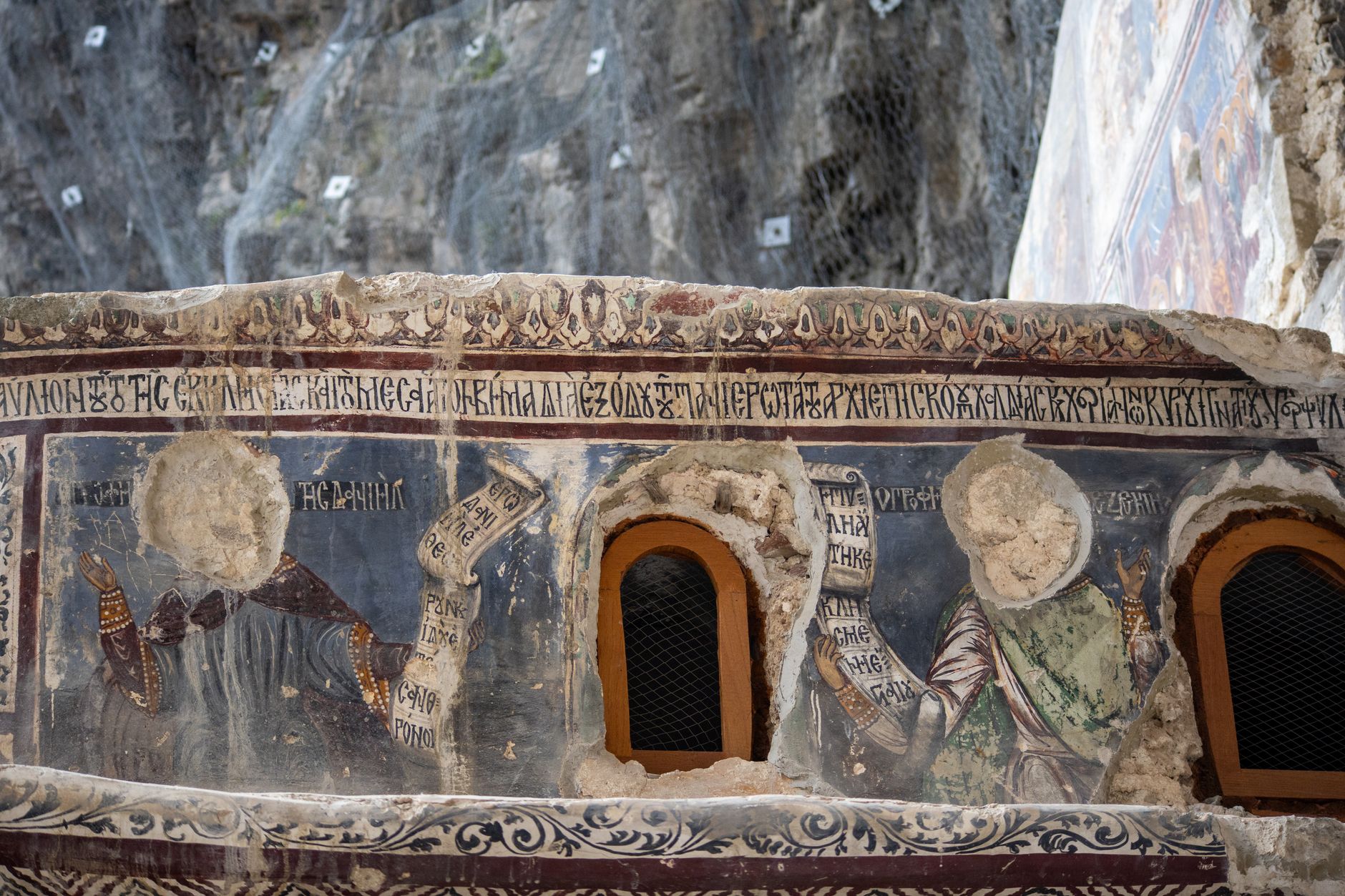 Detail of ancient frescoes depicting religious figures at Sumela Monastery.