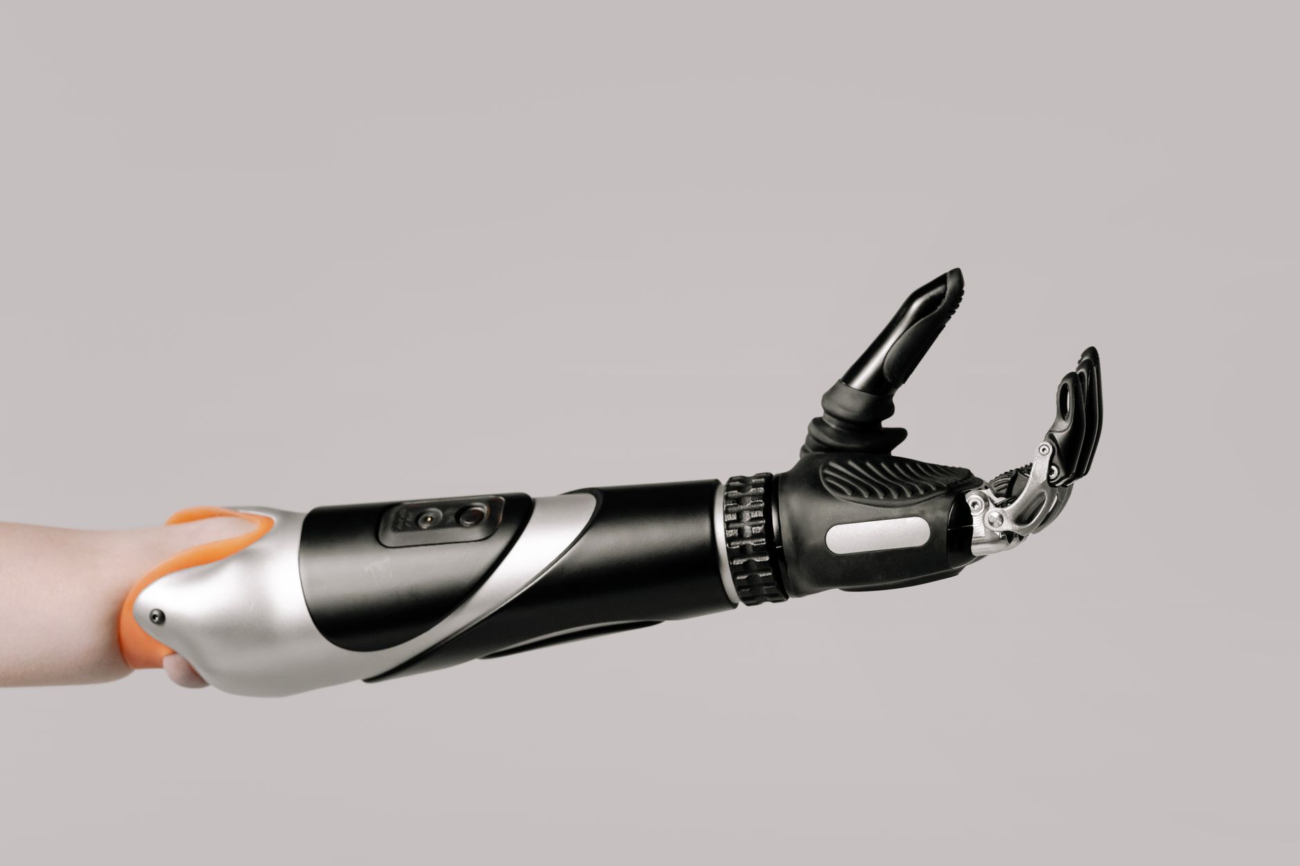 Close-up of a robotic arm prosthetic with fine manipulation features.