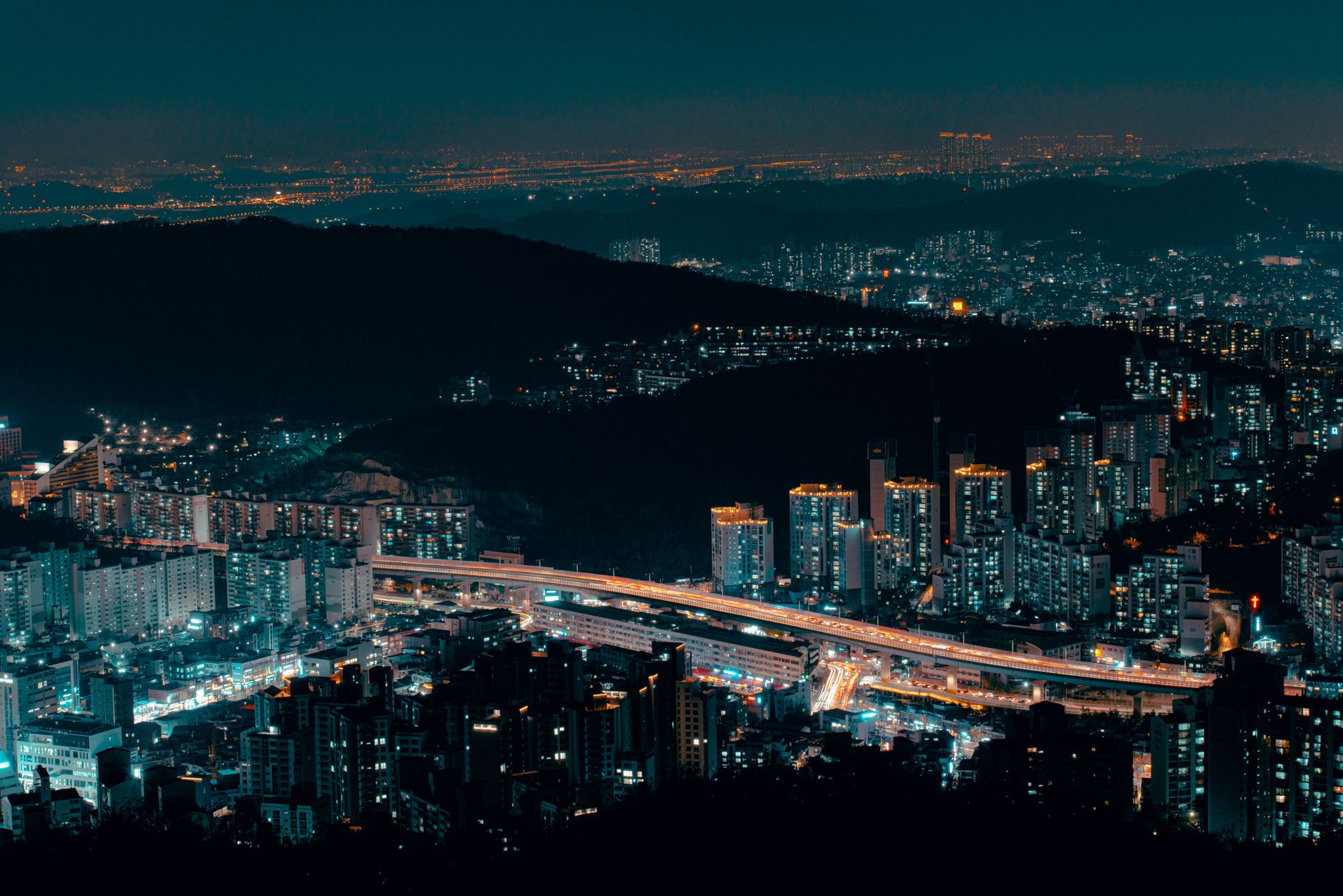 A stunning nighttime skyline of Seoul, South Korea, showcasing a vibrant cityscape.