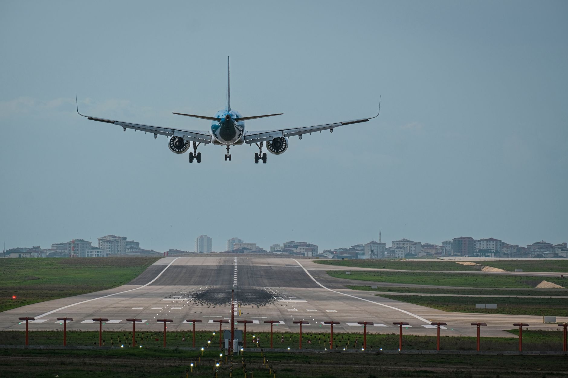 An aircraft approaches for landing on a runway in Istanbul, showcasing direct flight routes from Canada.