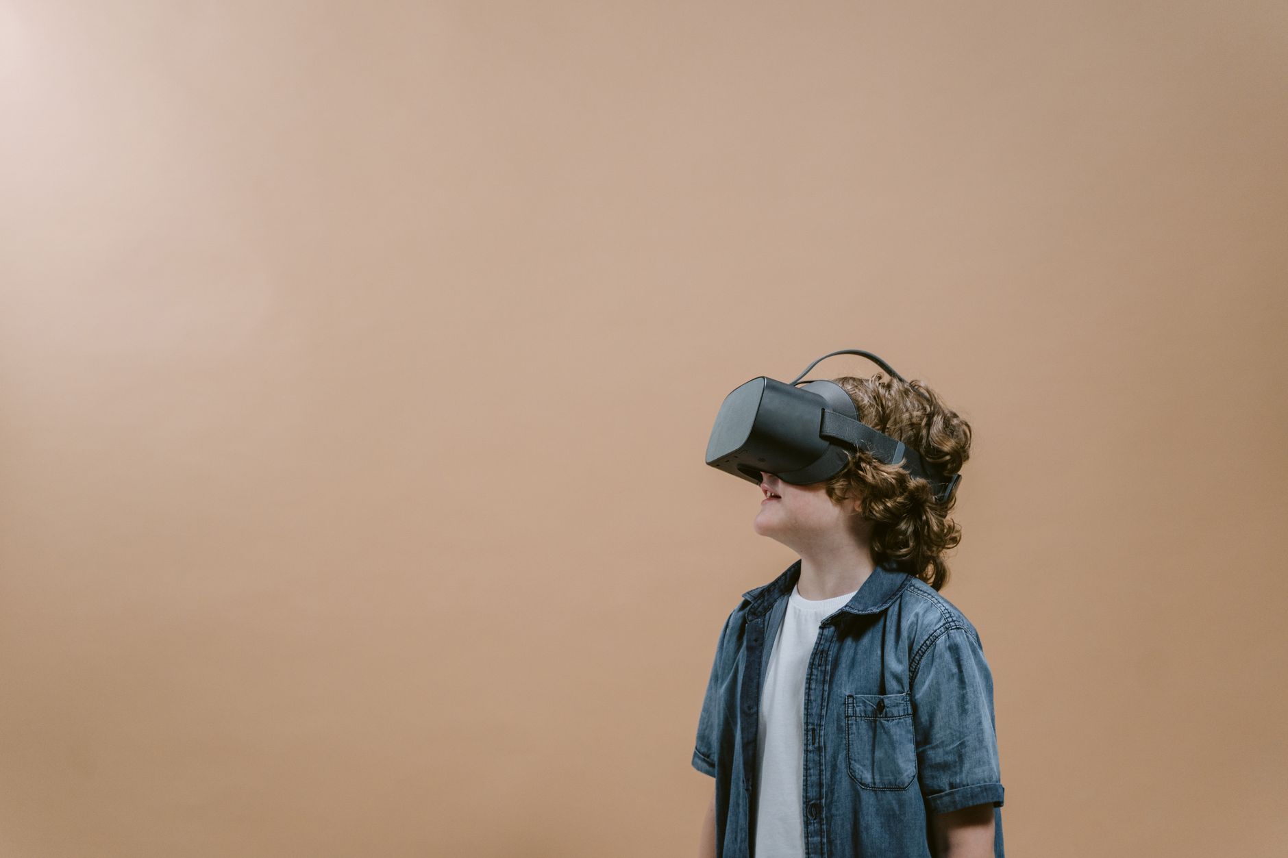 A young child wearing a virtual reality headset at a dental clinic in Turkey.