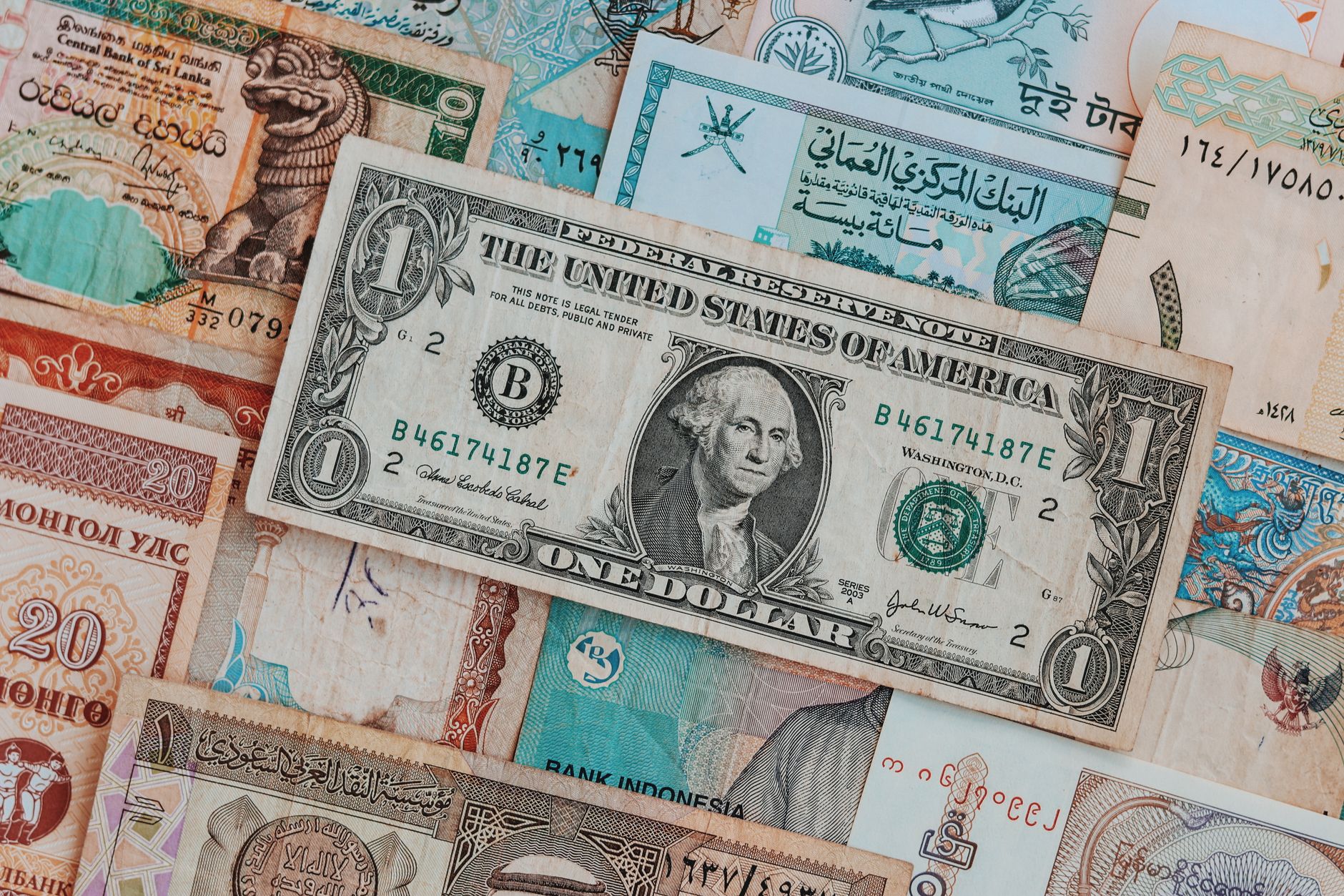 Close-up of different currencies including US dollar, reflecting currency considerations for international patients.