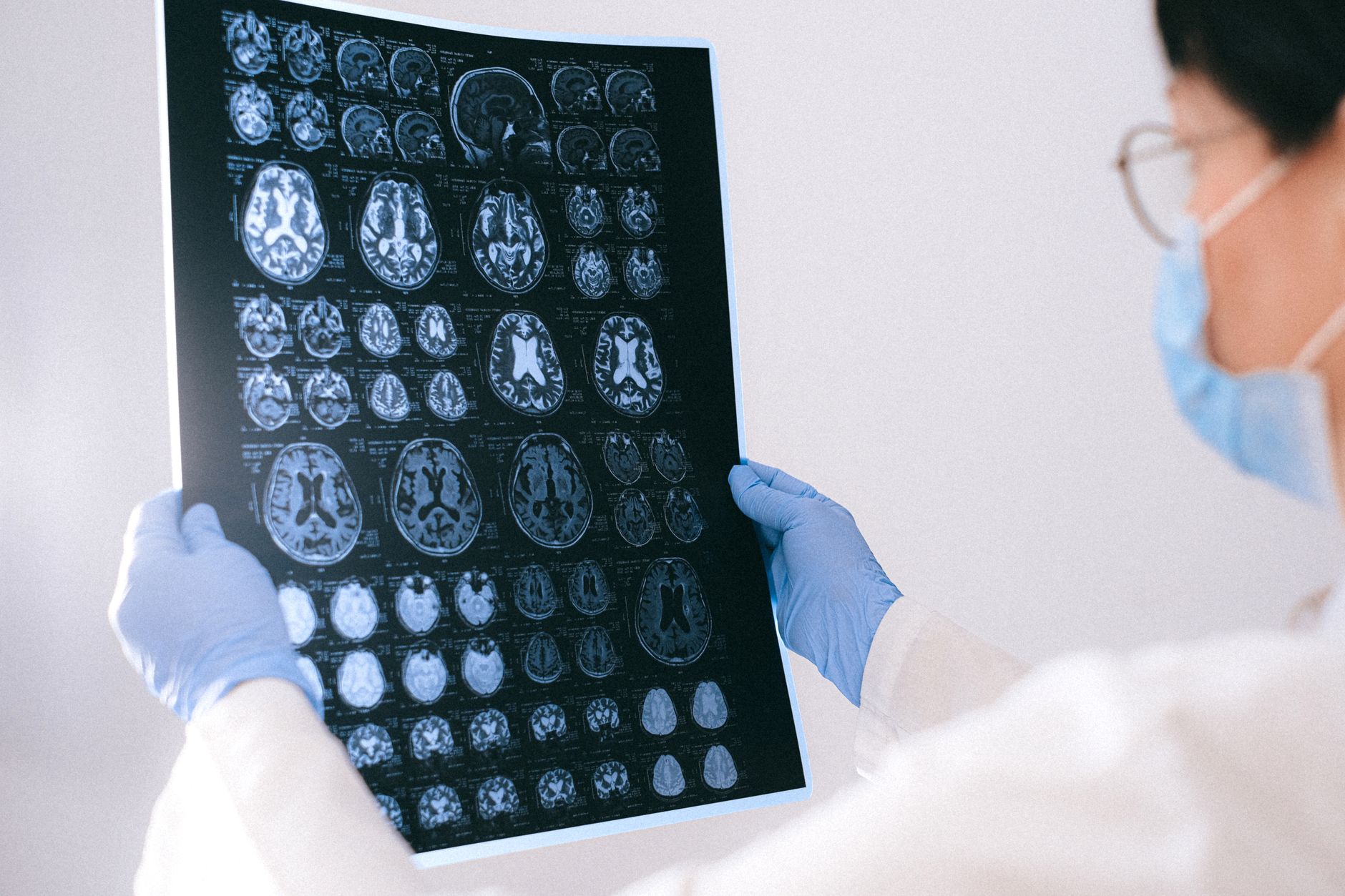 A radiologist in a Turkish clinic examines brain MRI scans, showcasing advanced imaging technology.