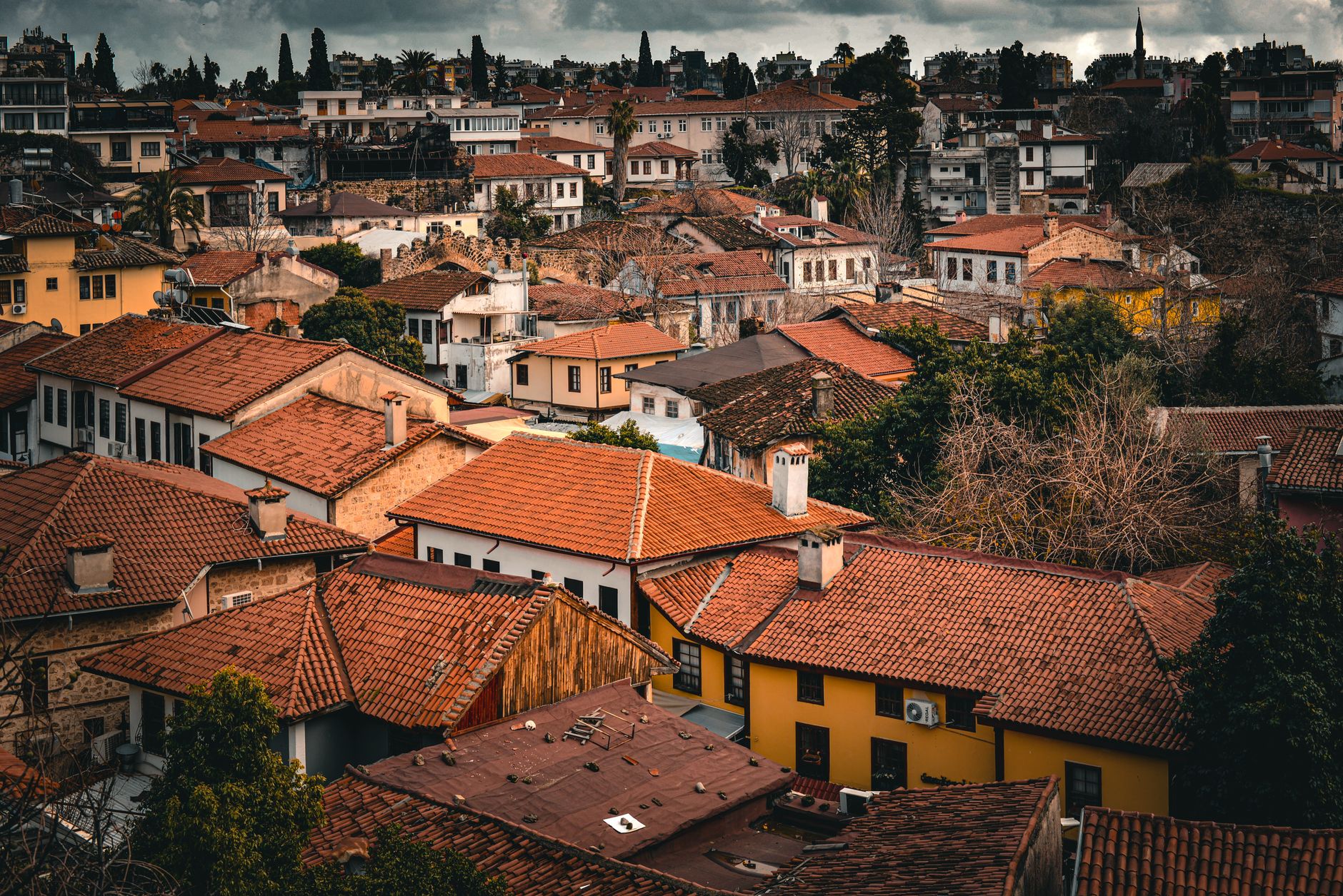 View of traditional rooftops in Antalya's old town on a winter day.