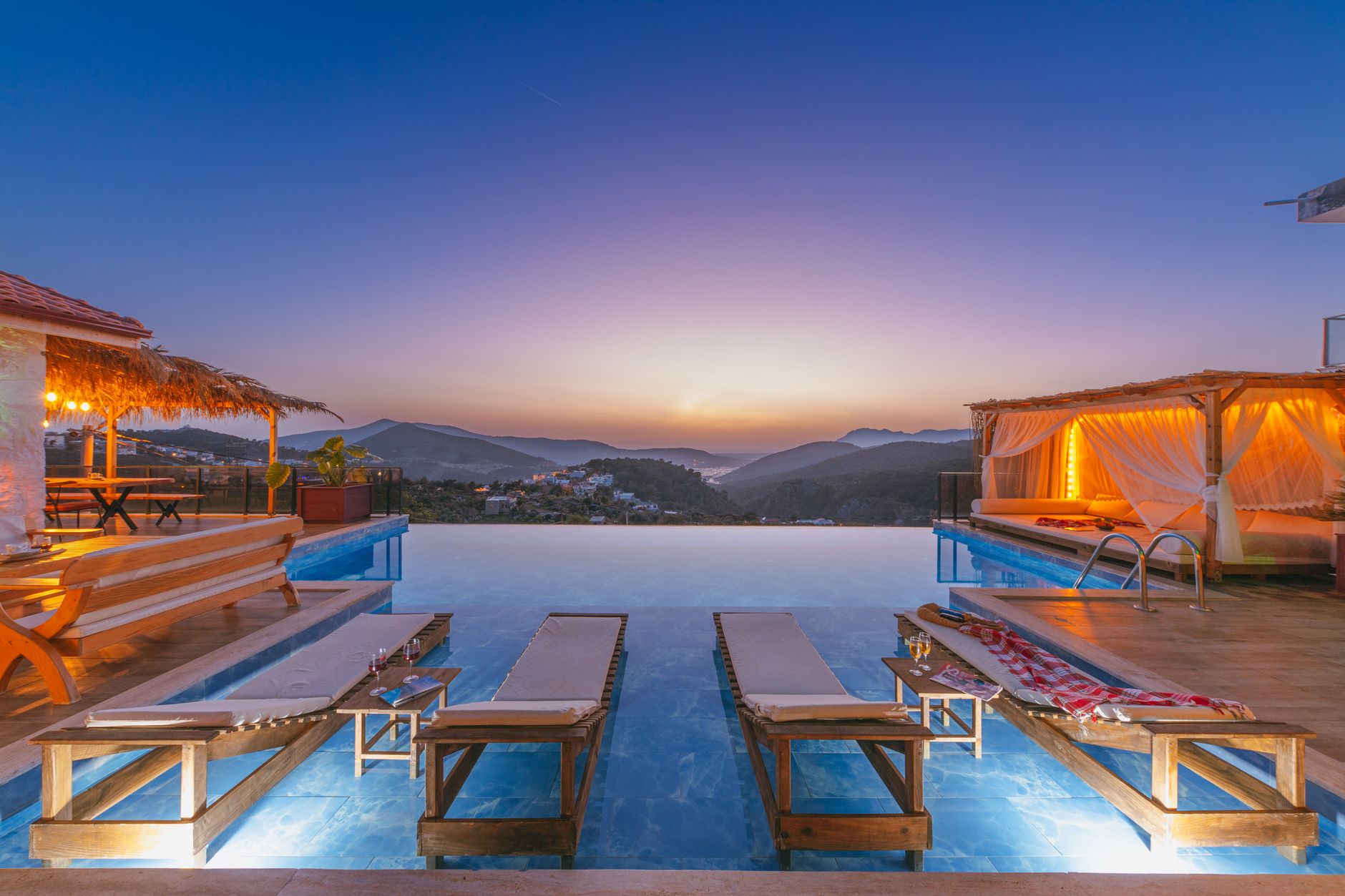 Stunning thermal mineral pool at a Turkish resort, with evening sky and mountain view.