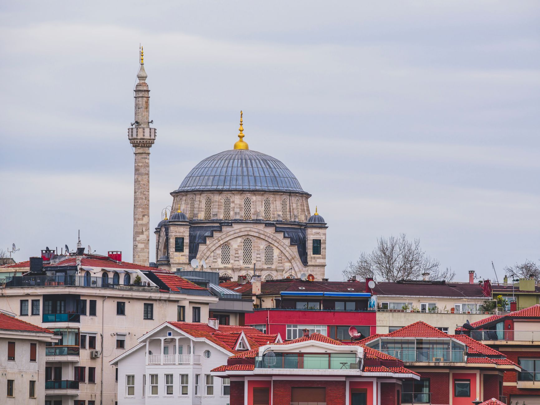 View of Istanbul showcasing a historic mosque dome and modern buildings.