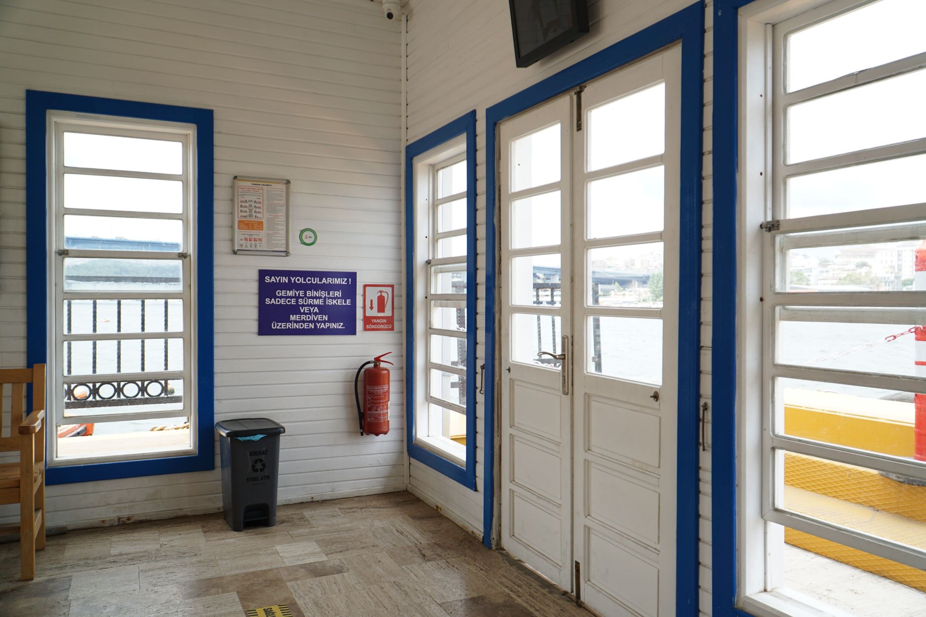 Ferry terminal interior in Samsun with windows, signage, and seating.
