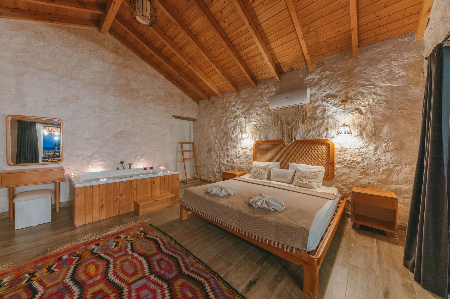 Serene hotel room featuring a cozy bed, wooden decor, and a relaxing bathtub, perfect for patient stays.