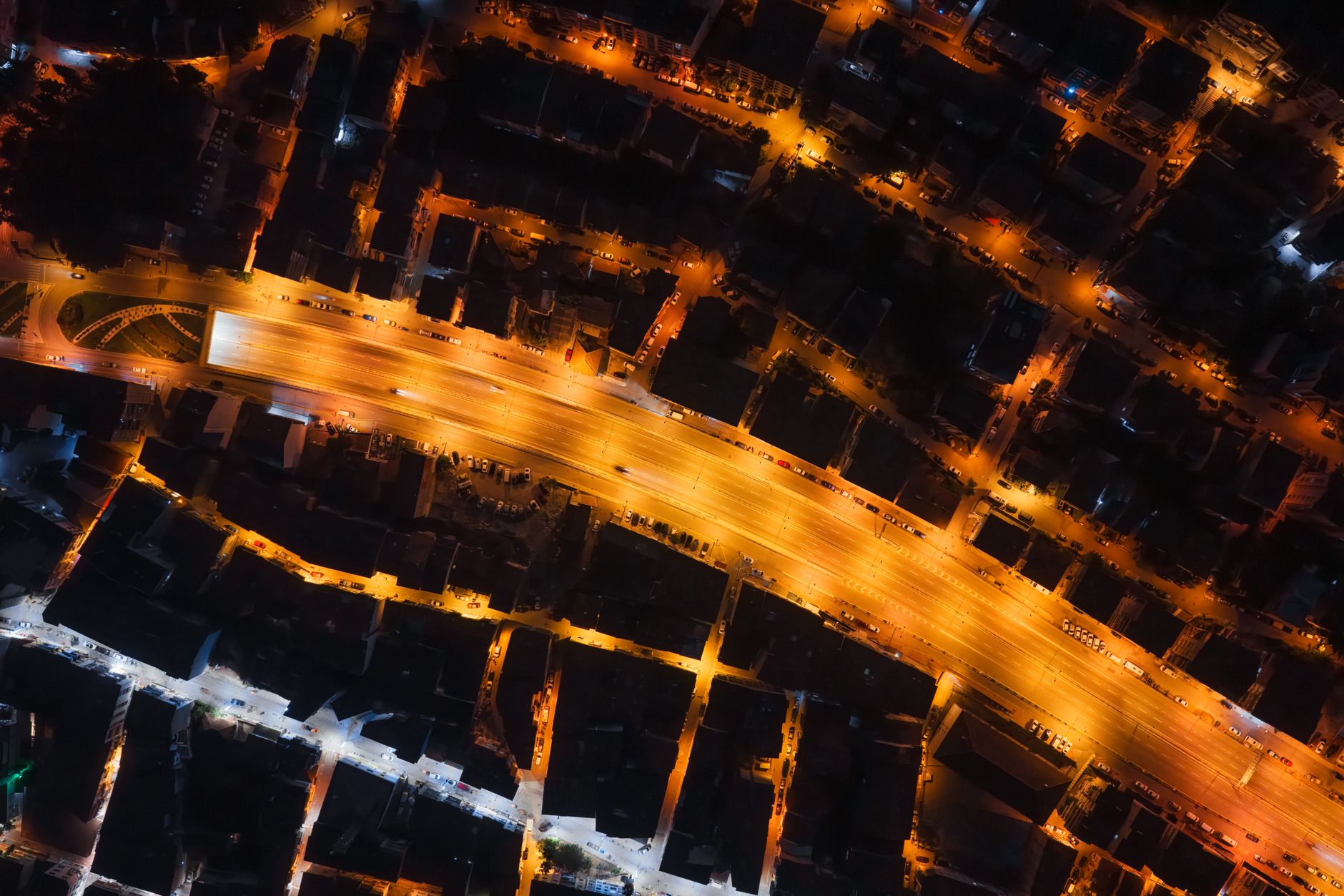 Nighttime aerial view of Kocaeli, featuring vibrant street lights and roadways.