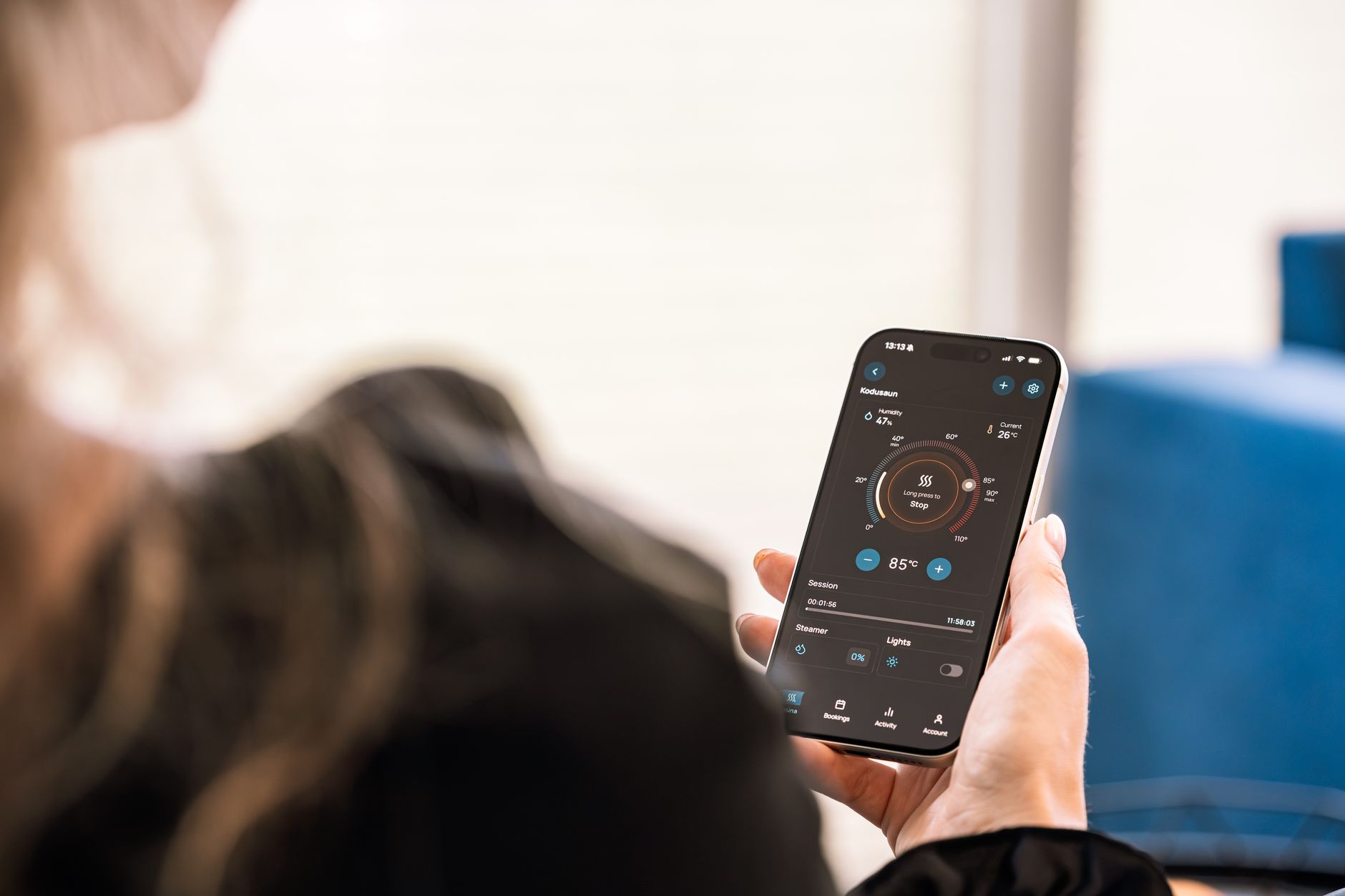 Close-up of a hand using a health tracking app on a smartphone.