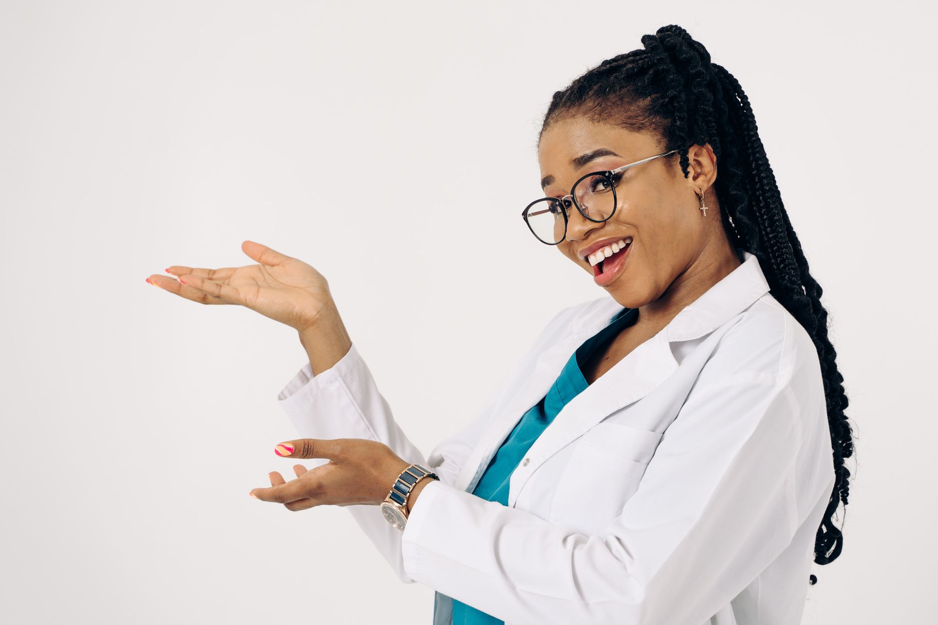 Smiling healthcare professional in lab coat presenting at a workshop.