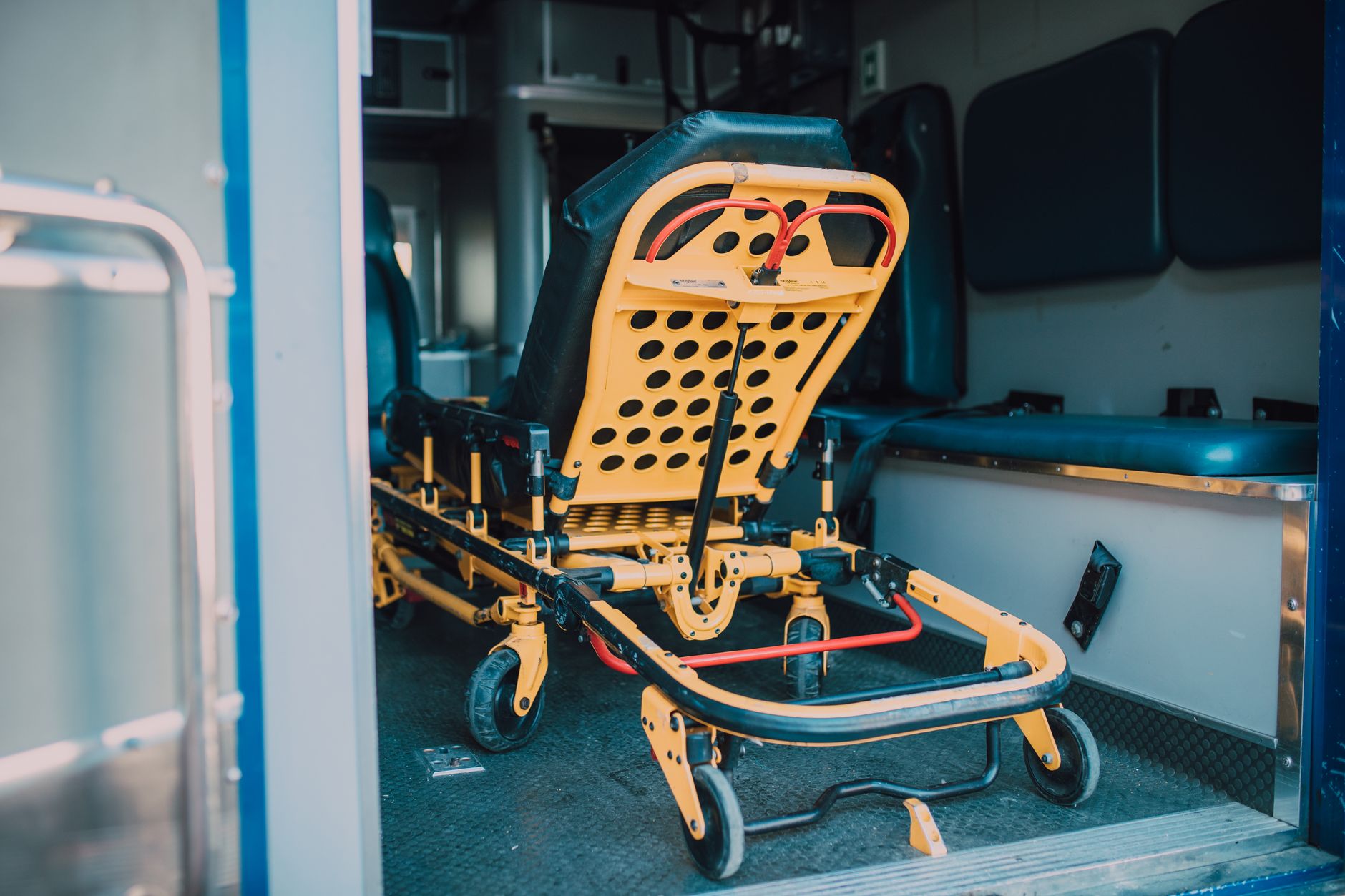 Interior view of air ambulance featuring a yellow stretcher and medical equipment.