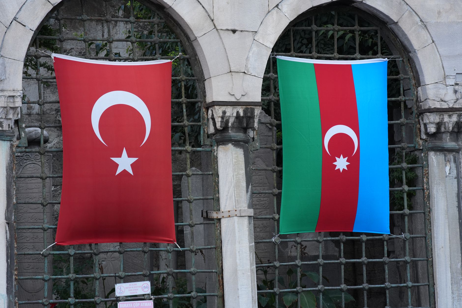 Turkish and Azerbaijani flags displayed together at a meeting venue in Türkiye.