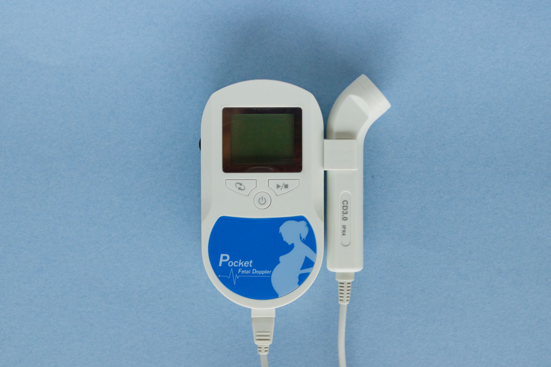 Close-up of a Pocket Fetal Doppler device for monitoring fetal heart rate.