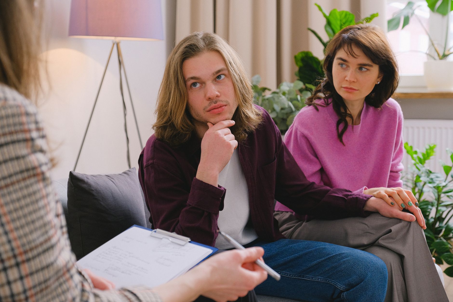 A couple engages in a counseling session, seeking emotional support for fertility issues.