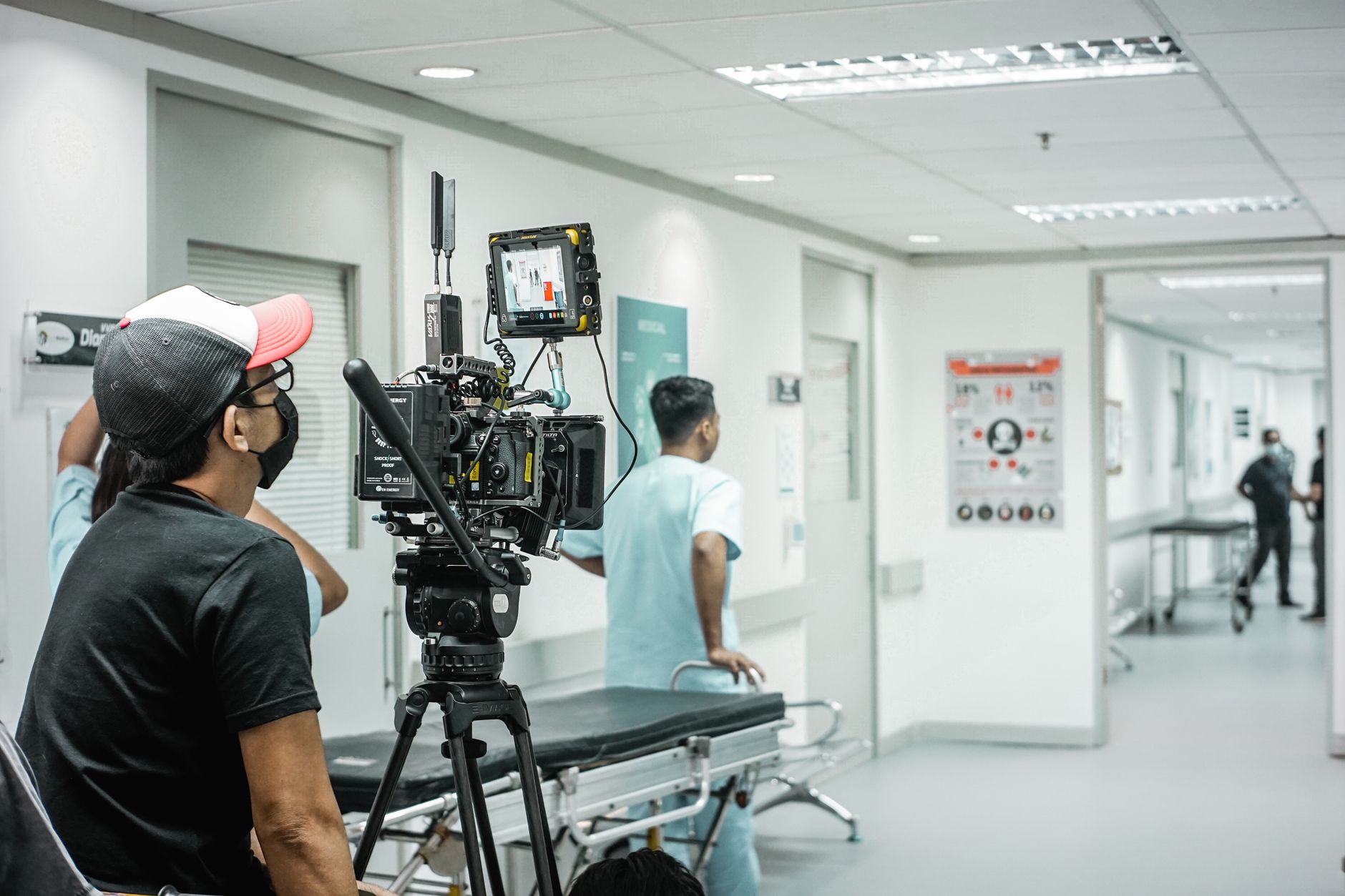A film crew captures scenes in a modern hospital corridor in Türkiye, showcasing advanced medical technology.