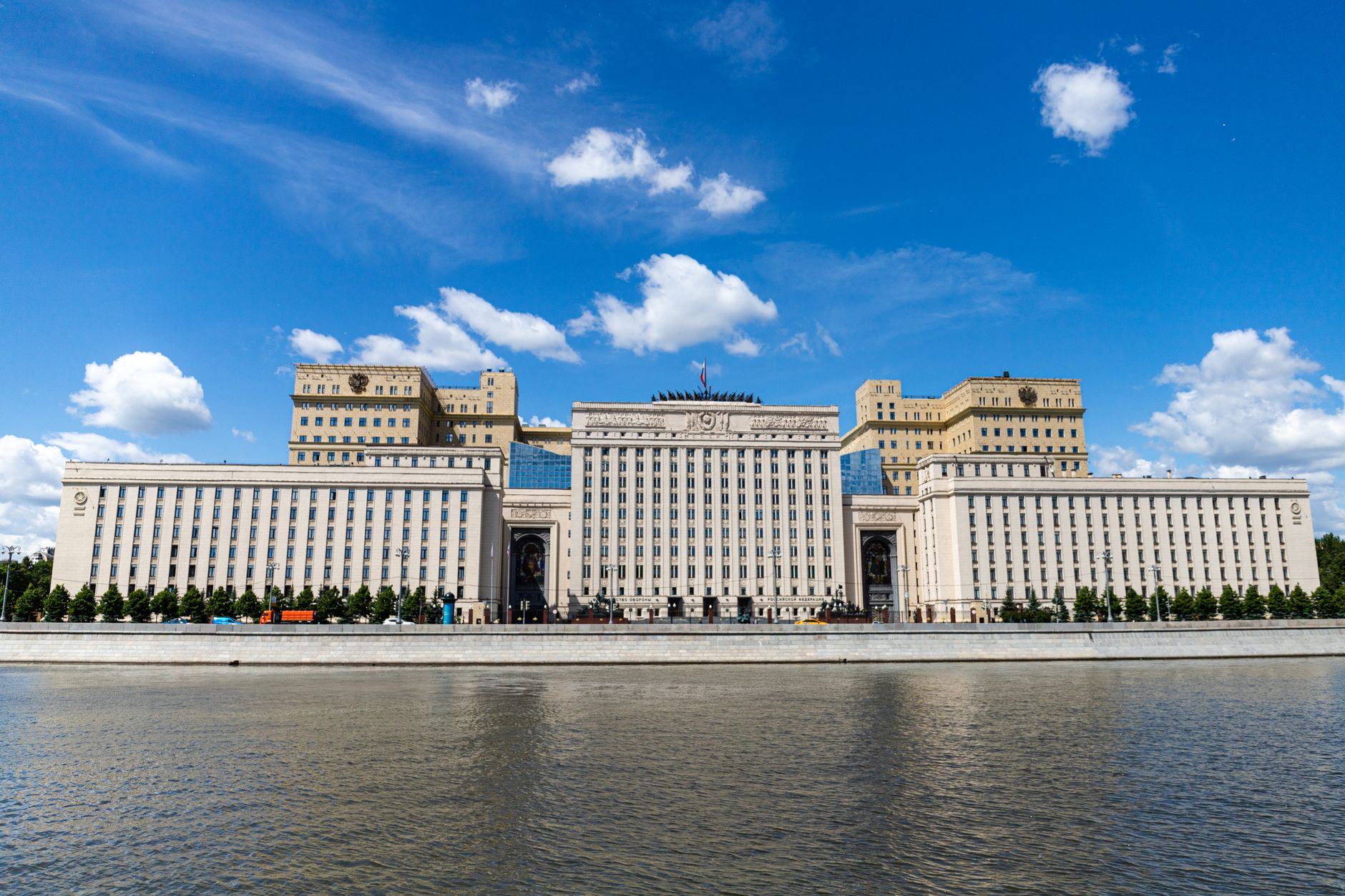 The Ministry of Defense building in Moscow with a clear blue sky above.