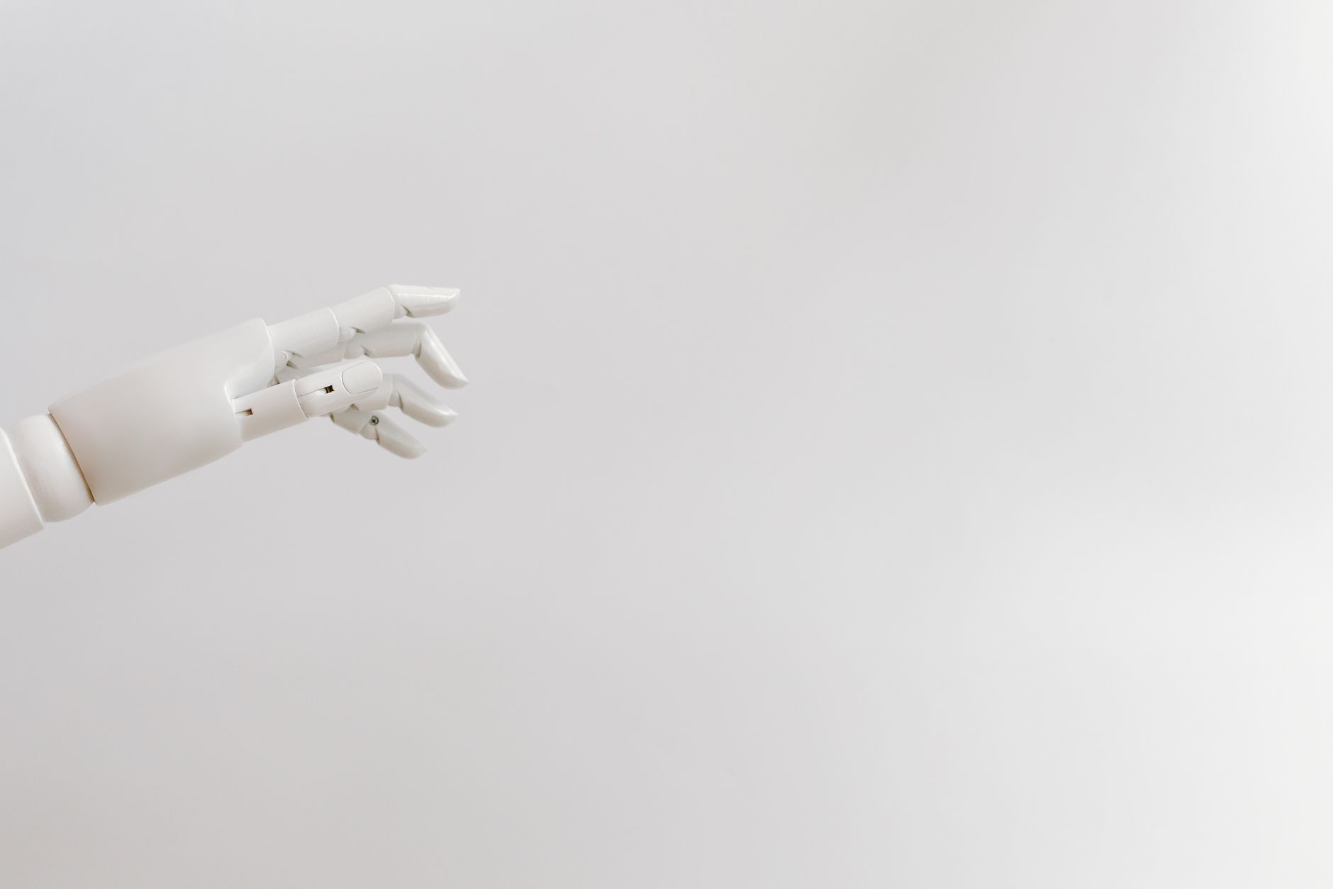 Close-up of a white robotic hand, symbolizing advanced technology in surgery.