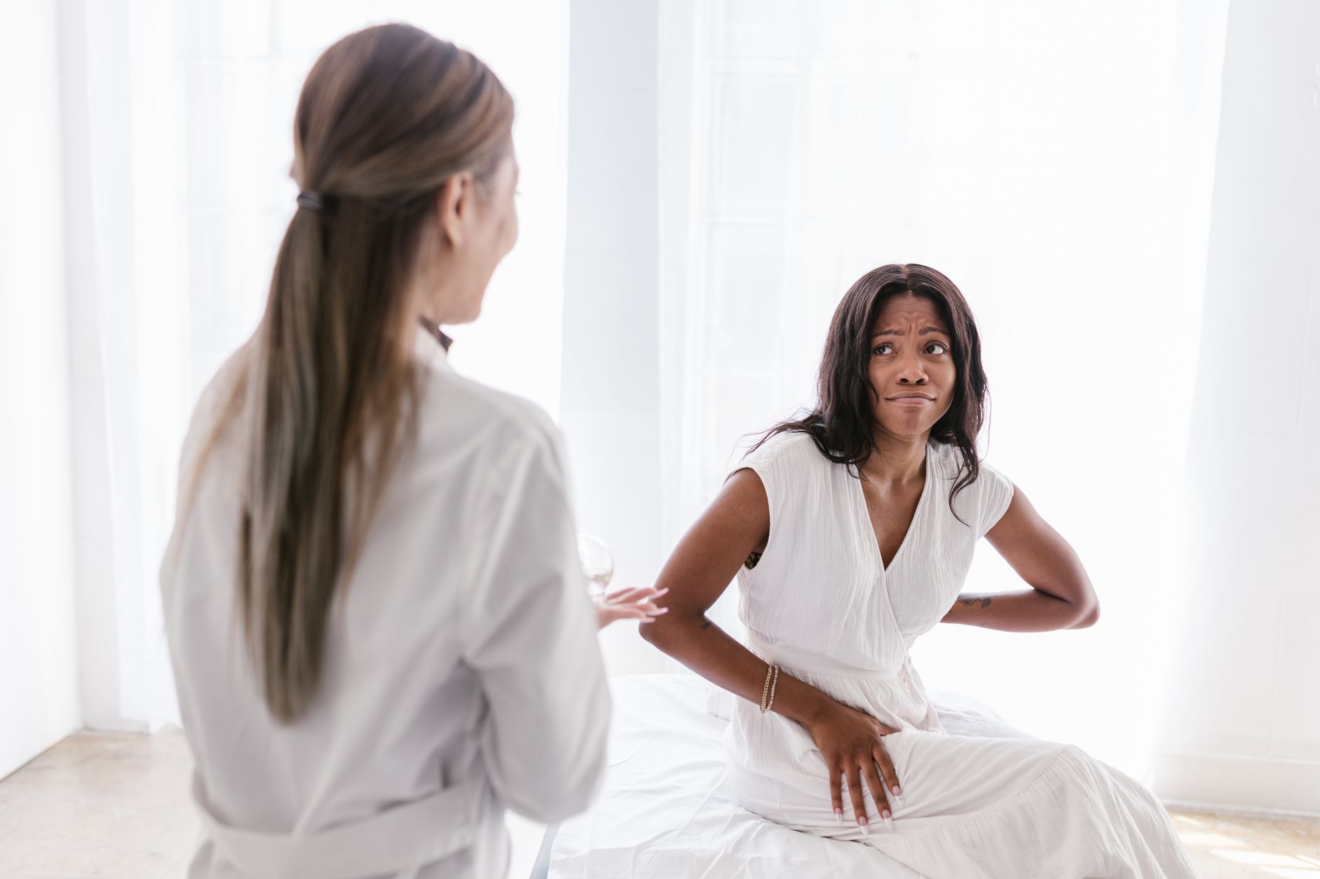 A healthcare specialist engages with an international patient discussing treatment plans and personalized care.