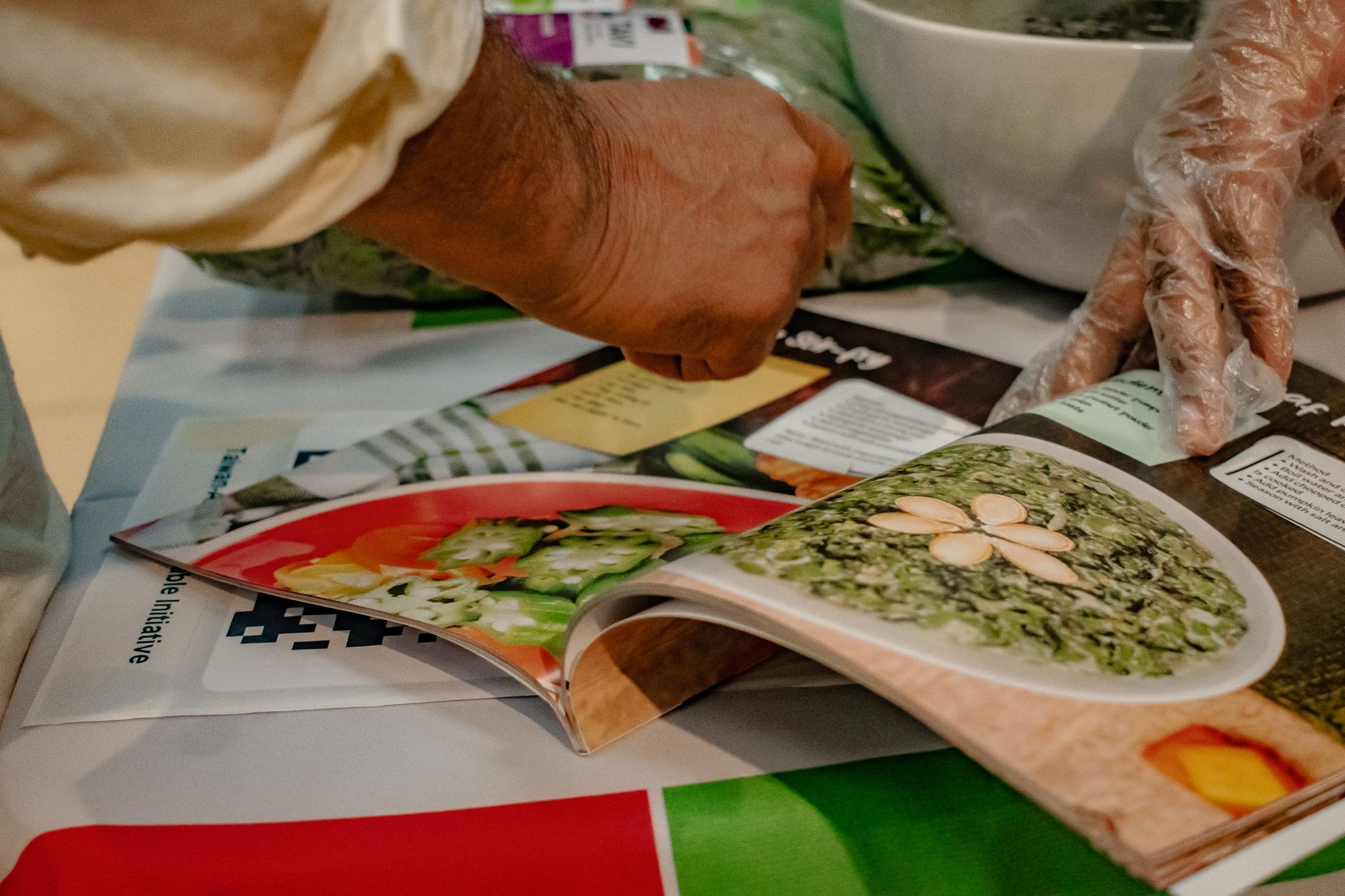 A patient consults a recipe book for bowel preparation instructions prior to a colonoscopy.